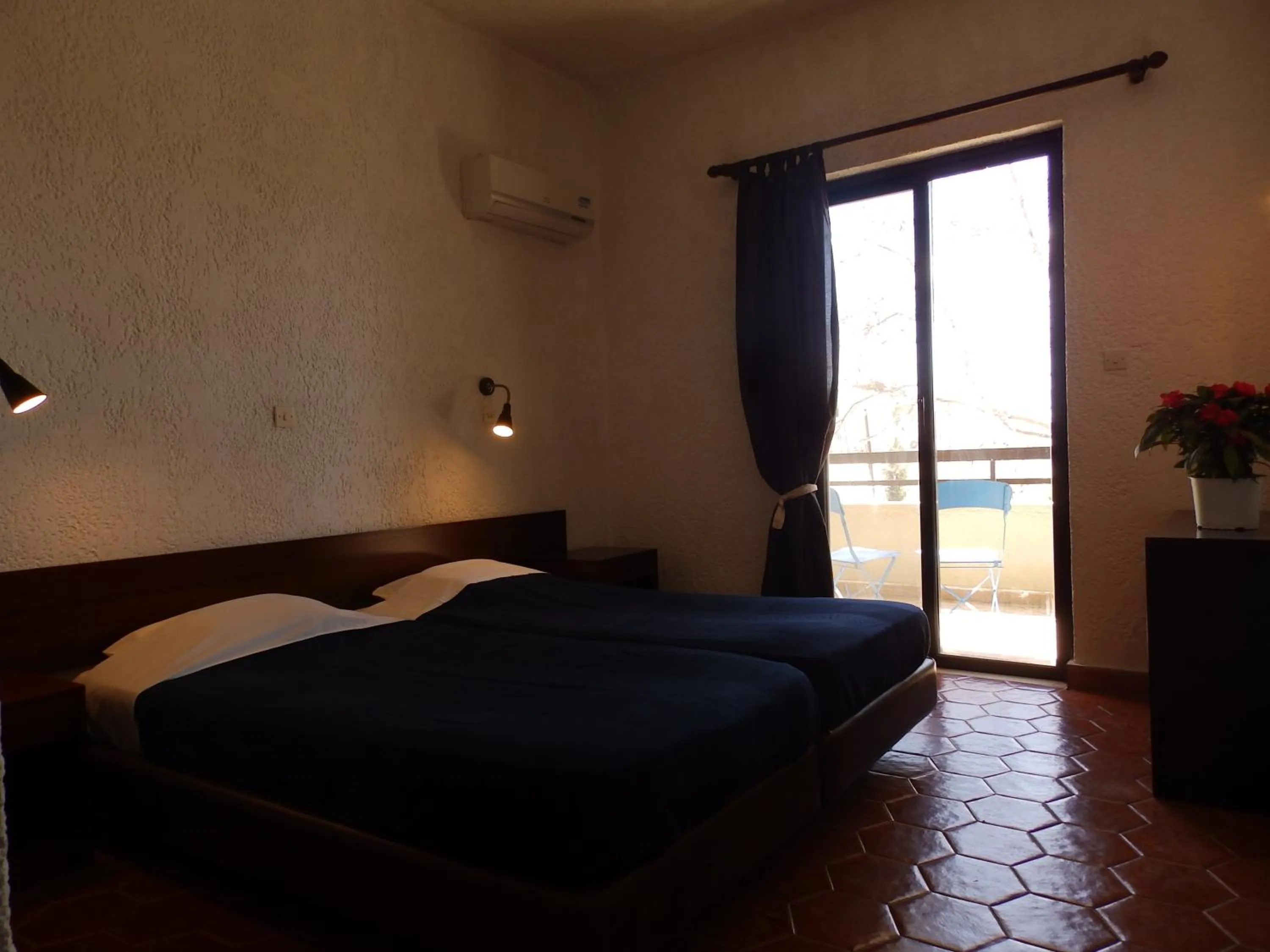 Bedroom, Bed in Emmanuel Apartments