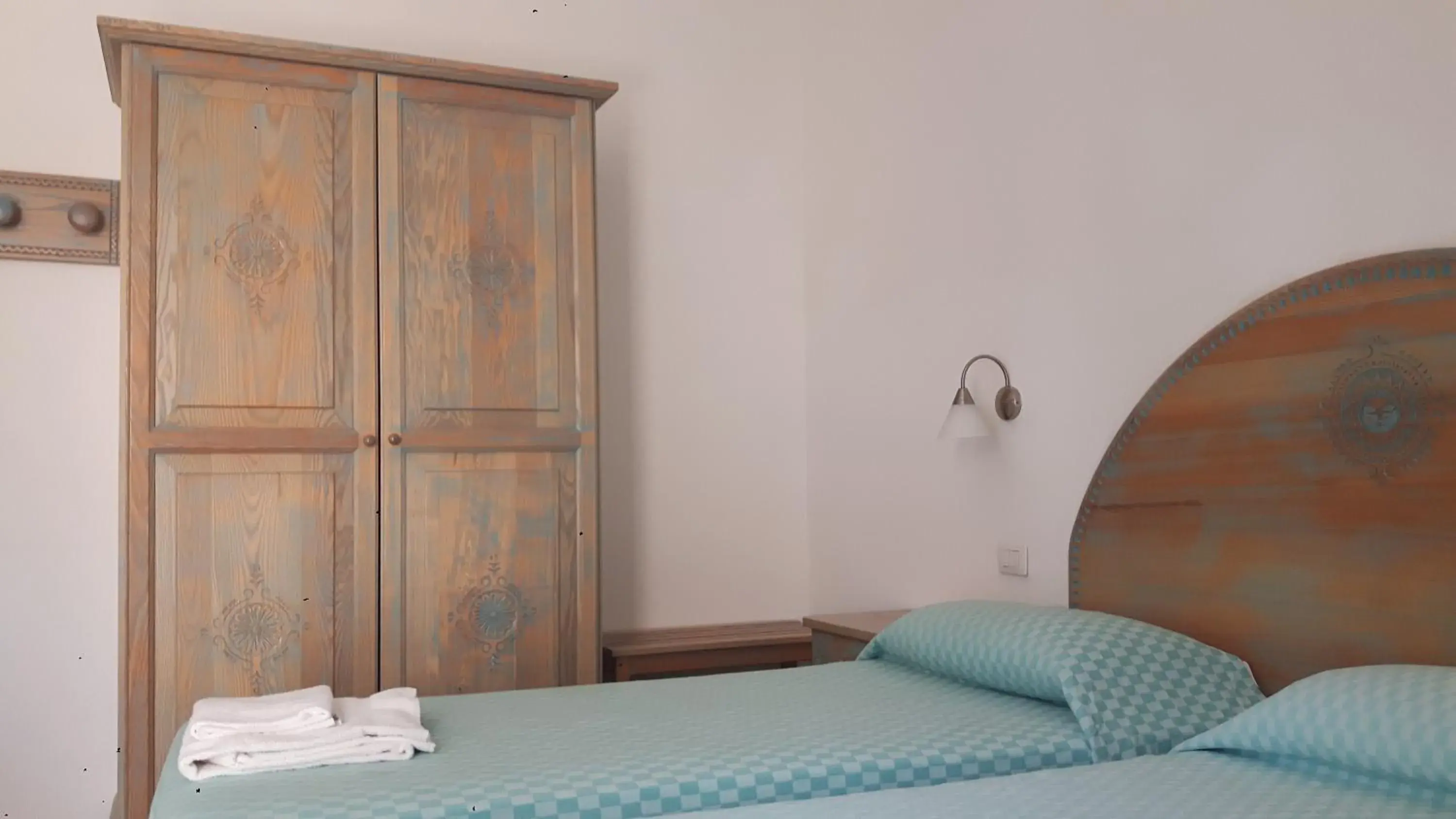Decorative detail, Bed in Alghero Vacanze Hotel Decorative detail, Bed in Alghero Vacanze Hotel