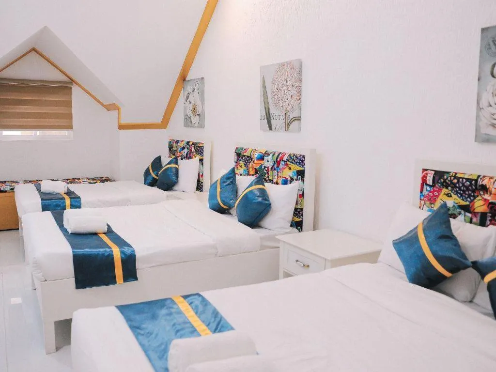 Bed in Villa Excellance Beach and Wave Pool Resort