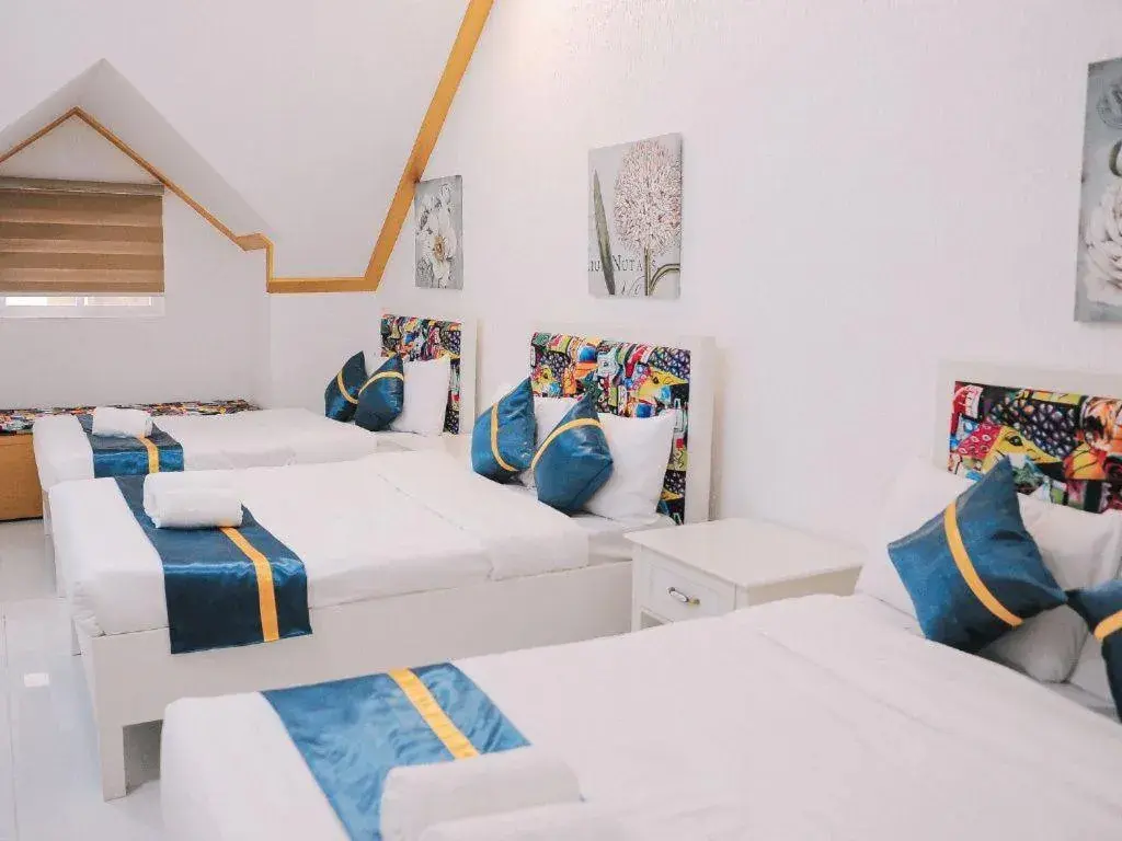 Bed in Villa Excellance Beach and Wave Pool Resort Bed in Villa Excellance Beach and Wave Pool Resort