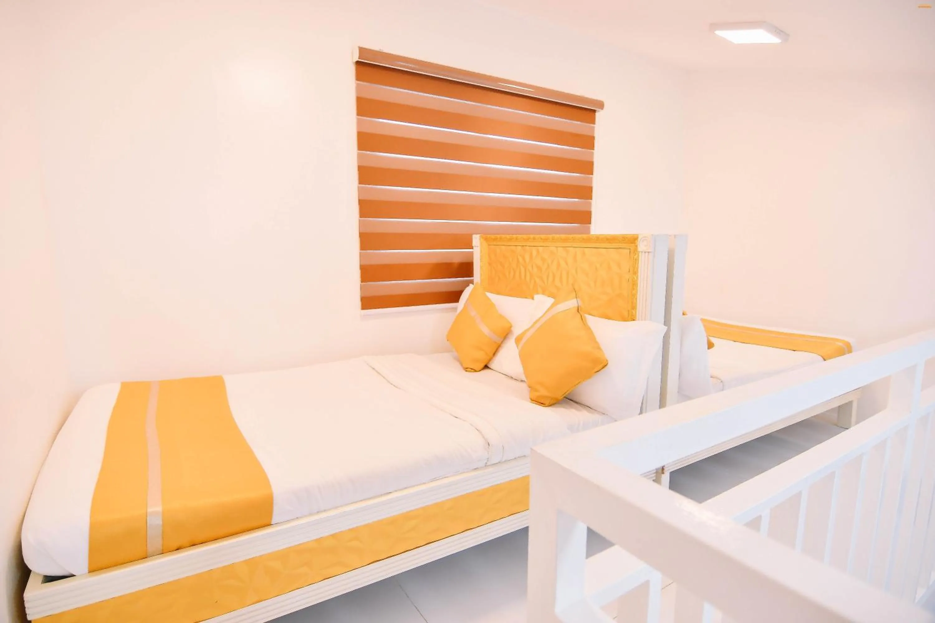 Bed in Villa Excellance Beach and Wave Pool Resort