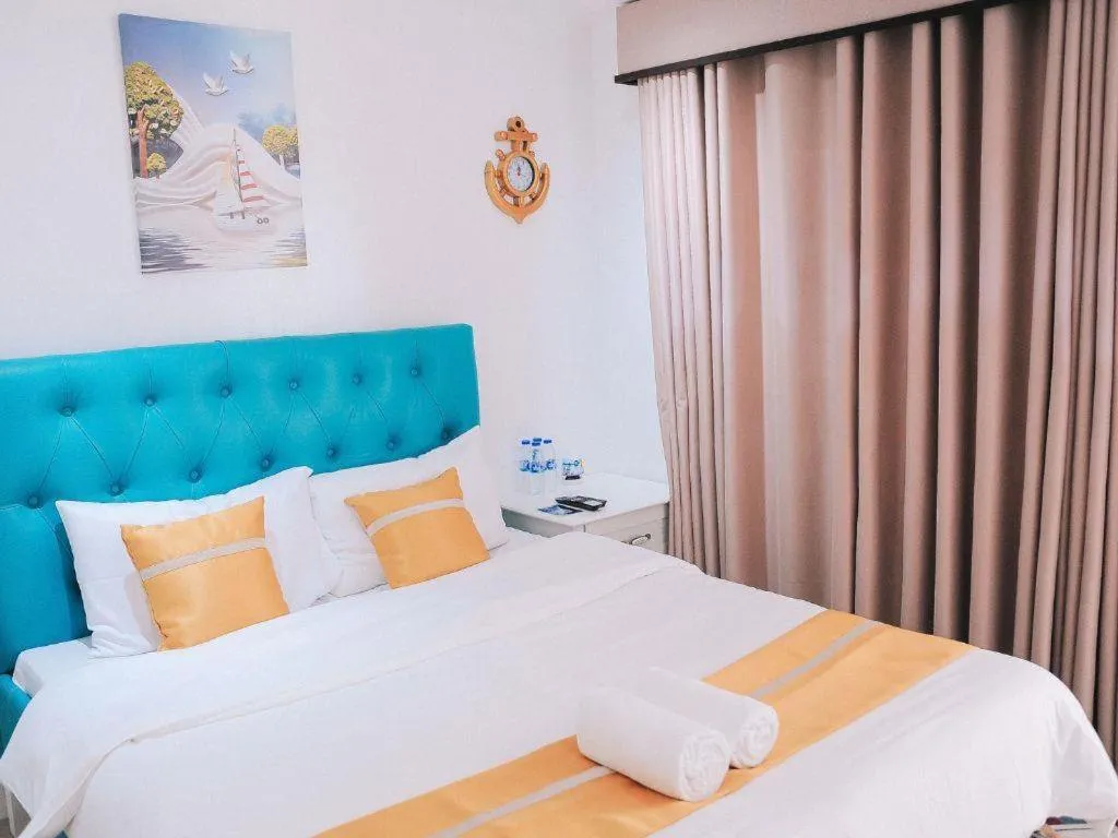 Bed in Villa Excellance Beach and Wave Pool Resort
