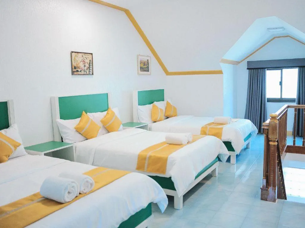 Bed in Villa Excellance Beach and Wave Pool Resort