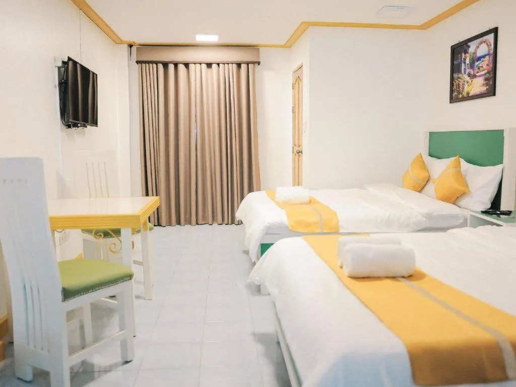 Bed in Villa Excellance Beach and Wave Pool Resort