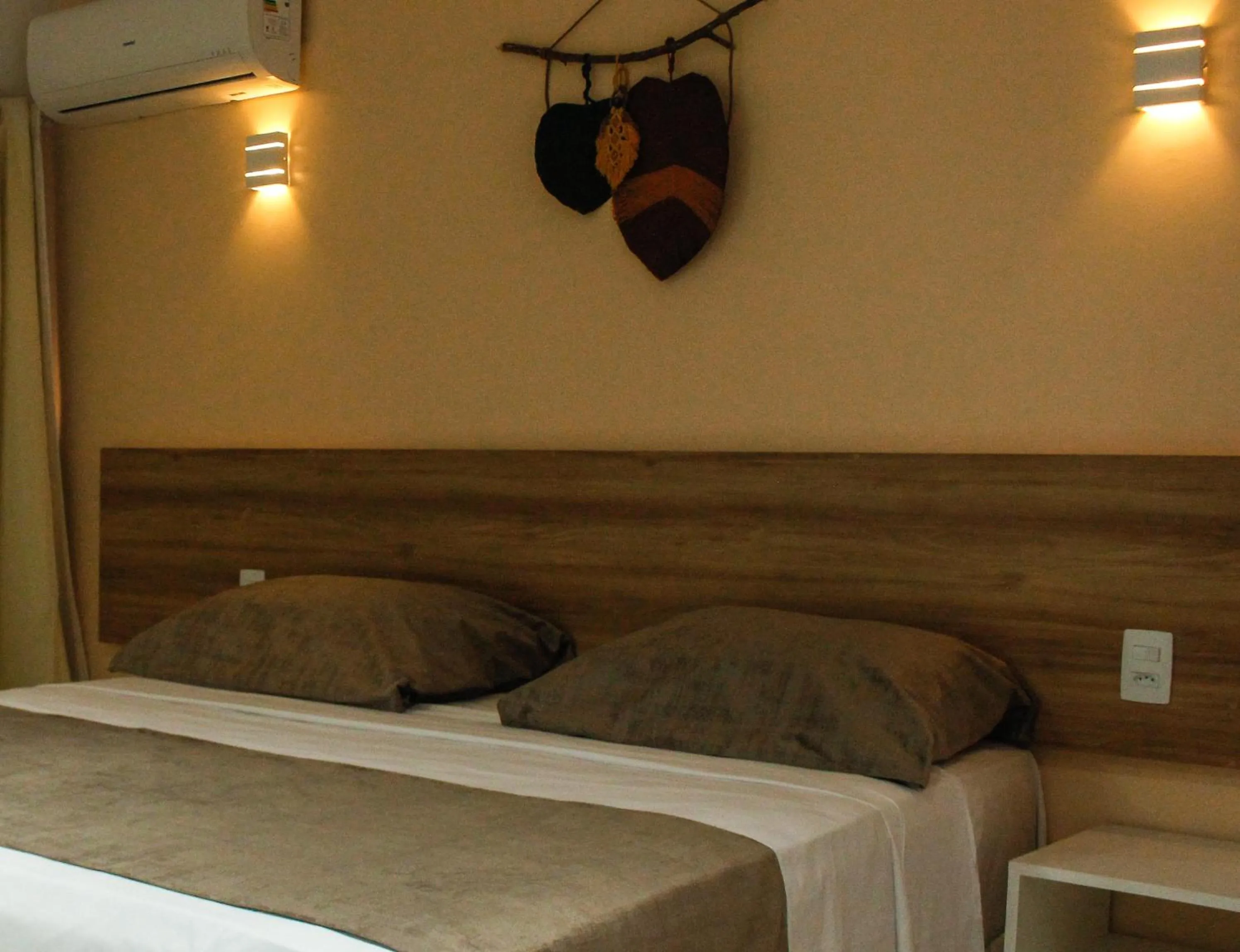 Bed in Pousada Jardins Tropical