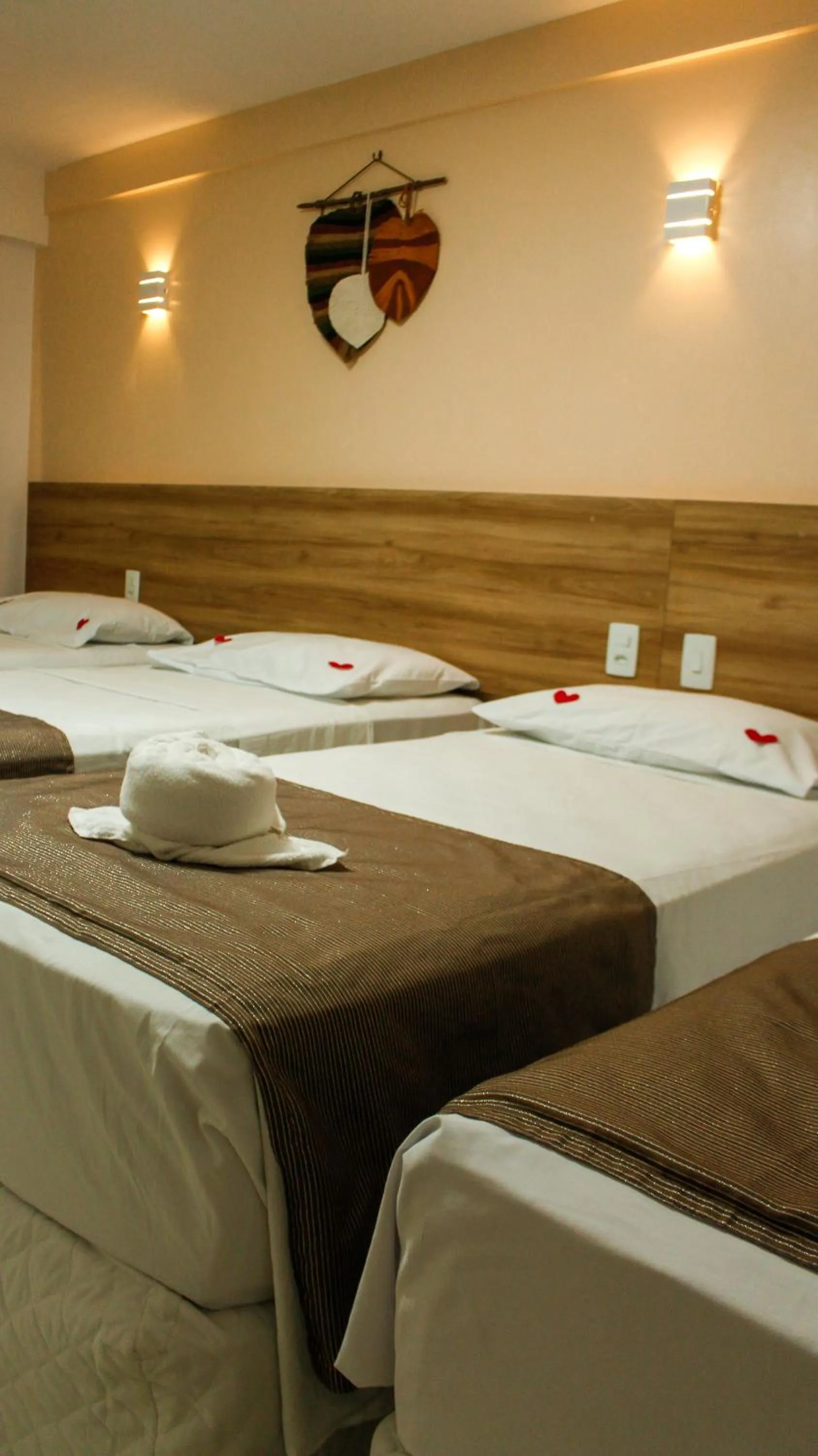 Bed in Pousada Jardins Tropical