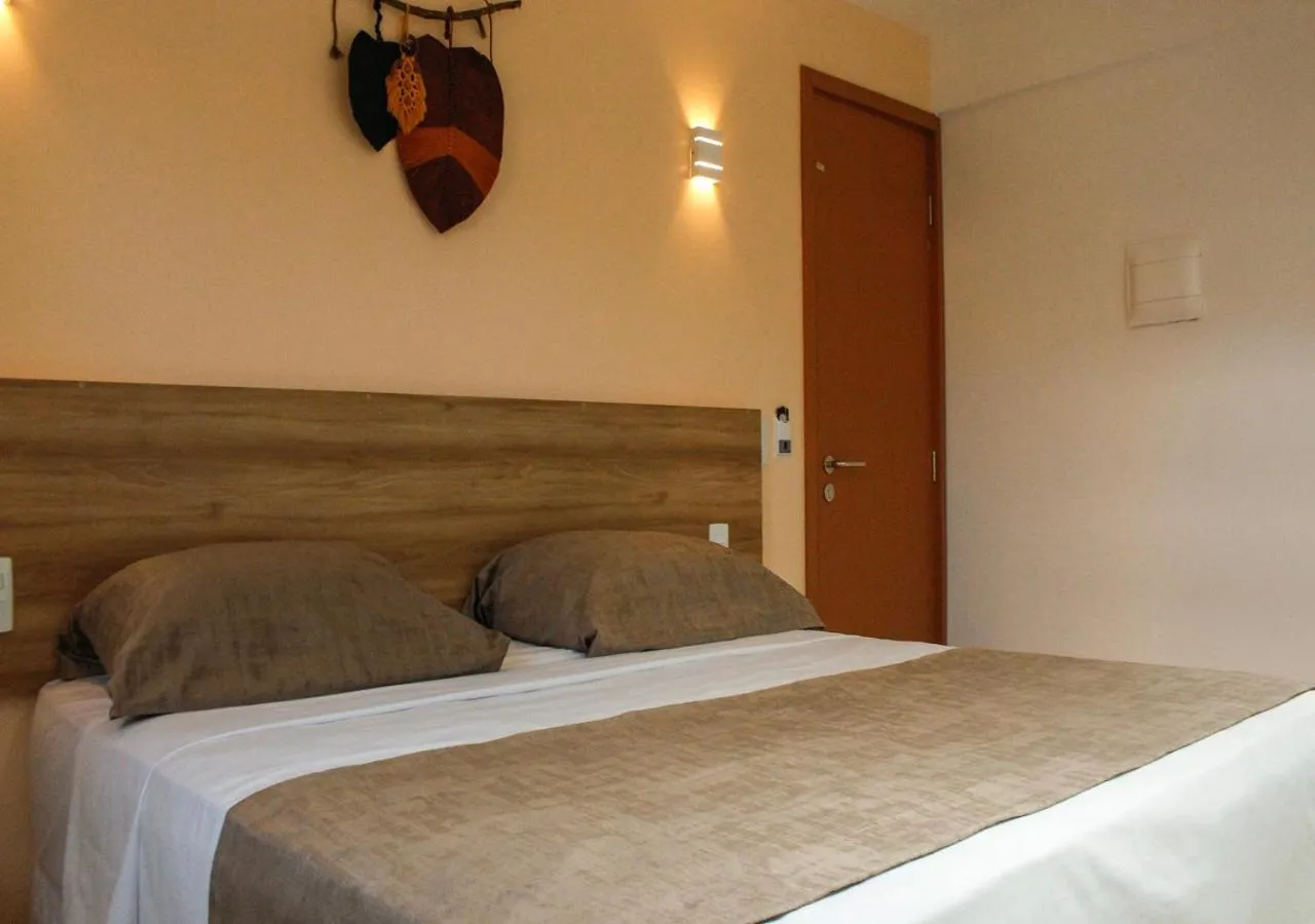 Bed in Pousada Jardins Tropical