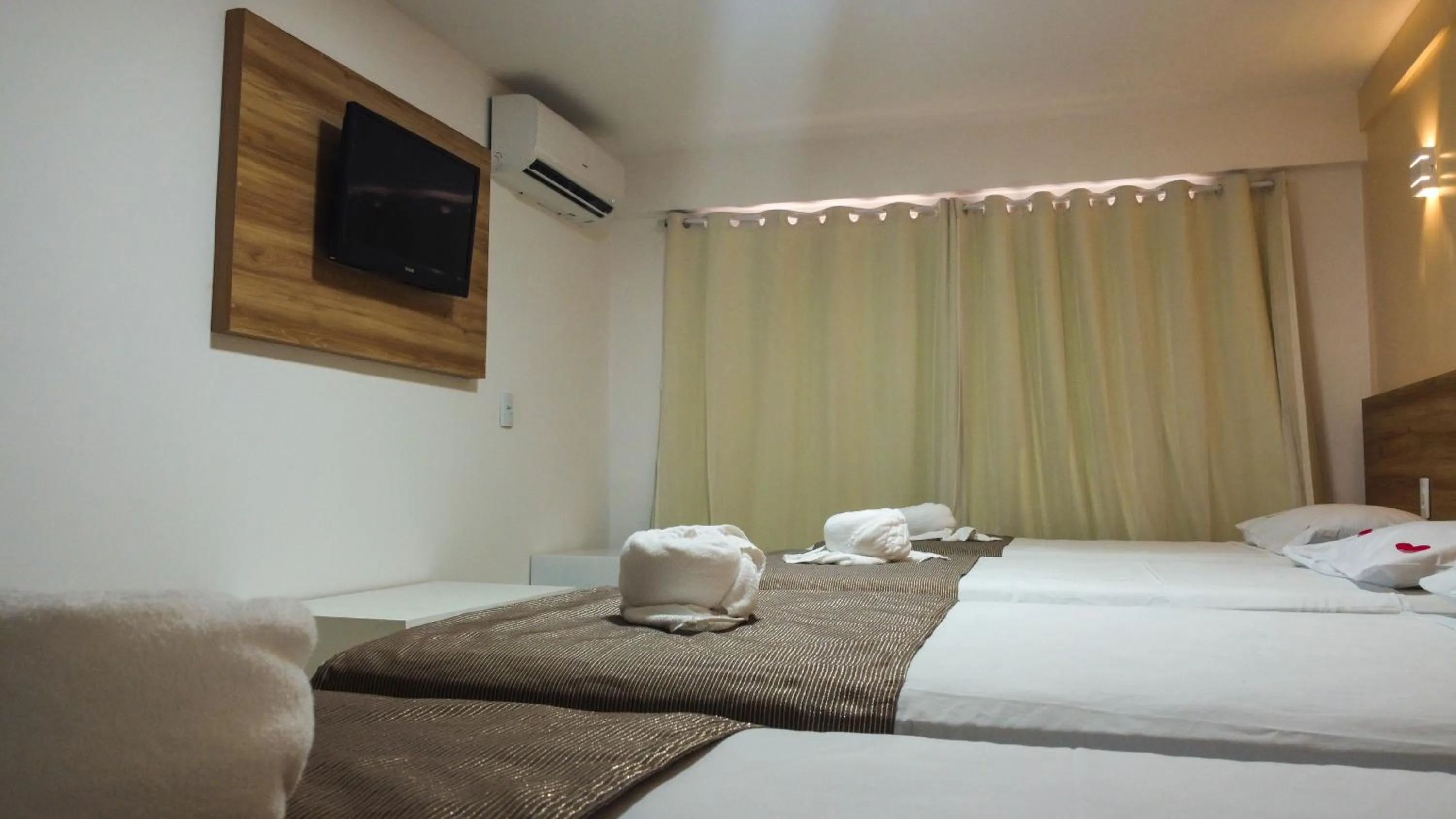 Bed in Pousada Jardins Tropical