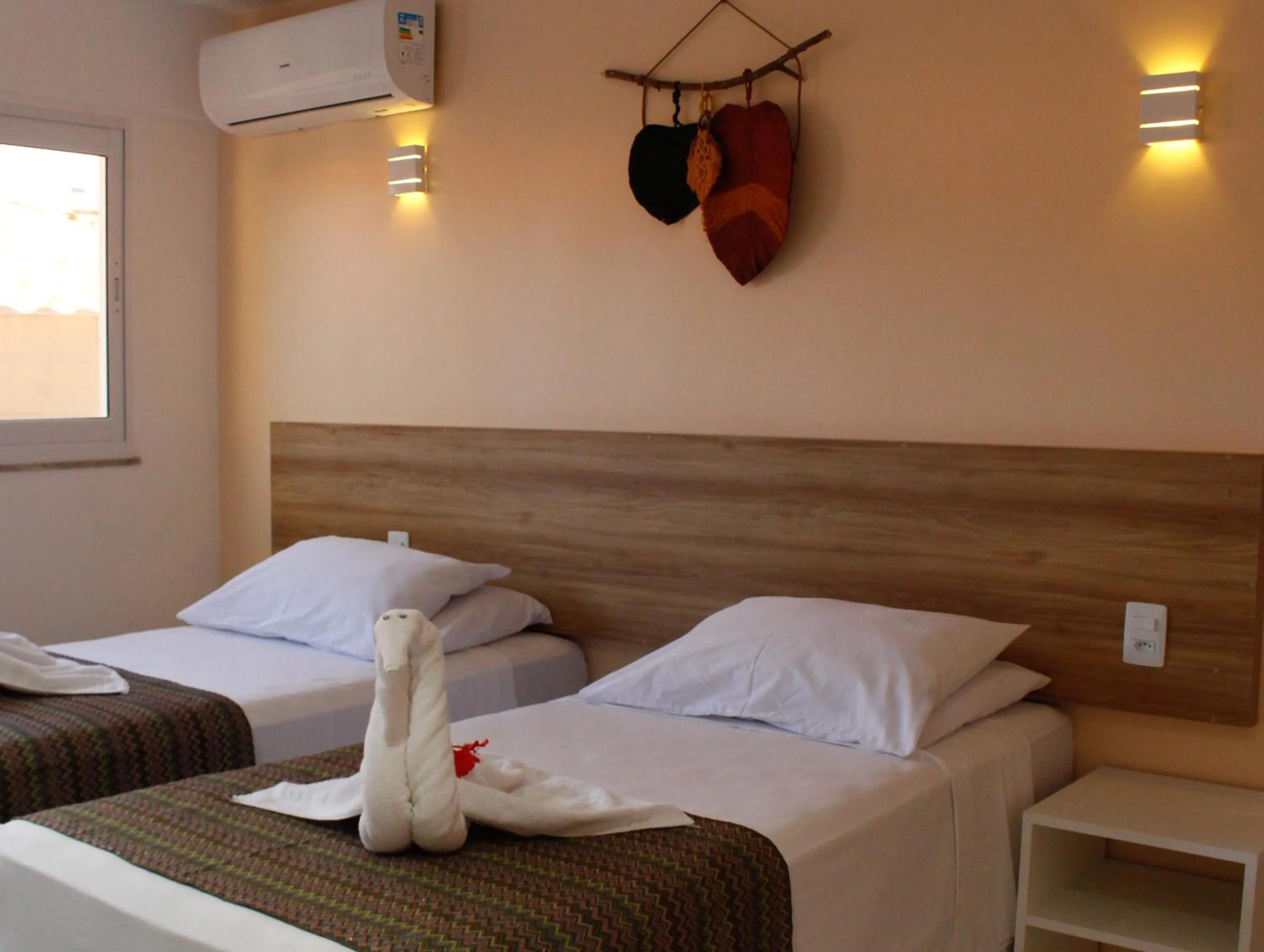 Bed in Pousada Jardins Tropical