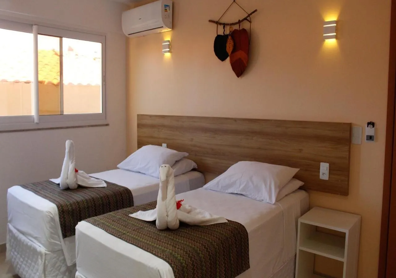 Bed in Pousada Jardins Tropical