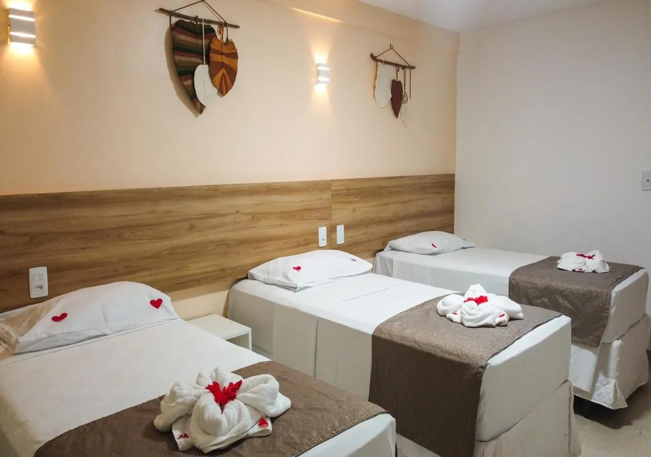 Bed in Pousada Jardins Tropical