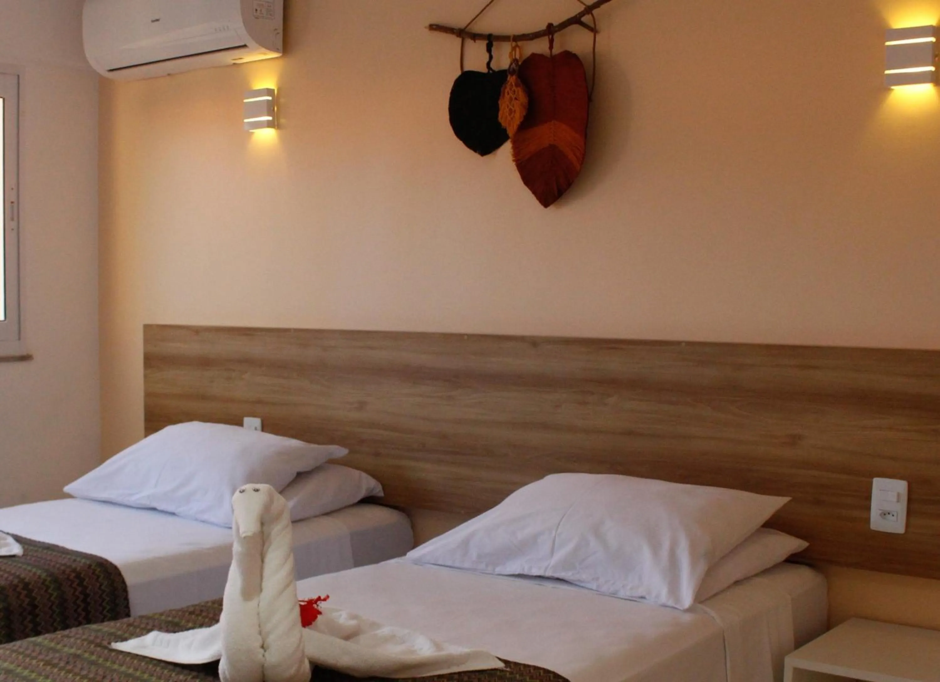 Bed in Pousada Jardins Tropical