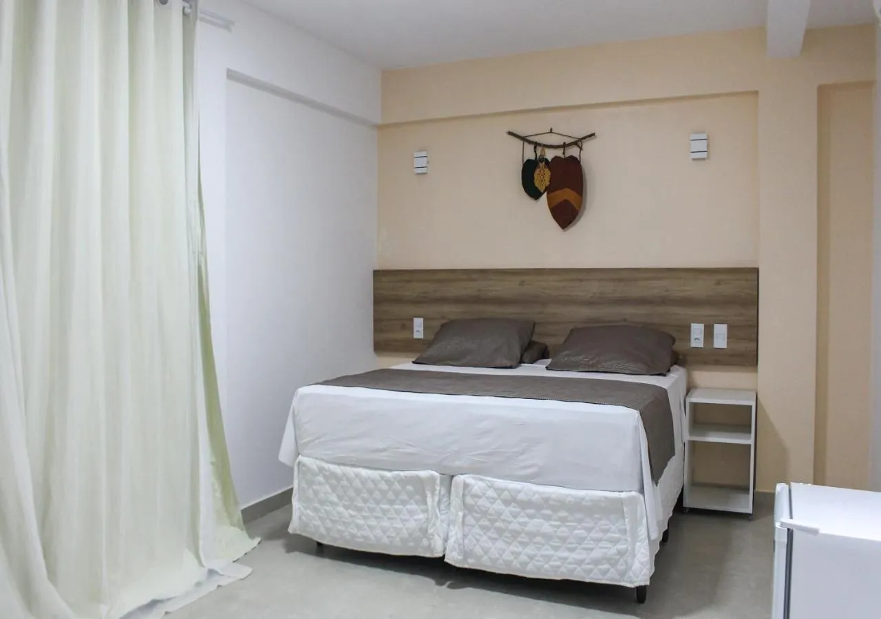 Bed in Pousada Jardins Tropical