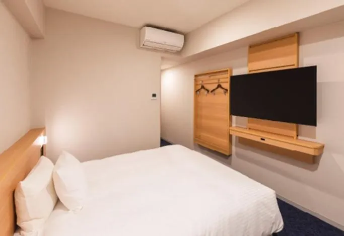 Bed in Sotetsu Grand Fresa Kumamoto