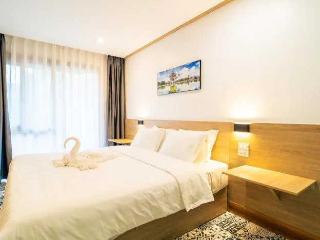 Bed in New Champa Boutique Hotel