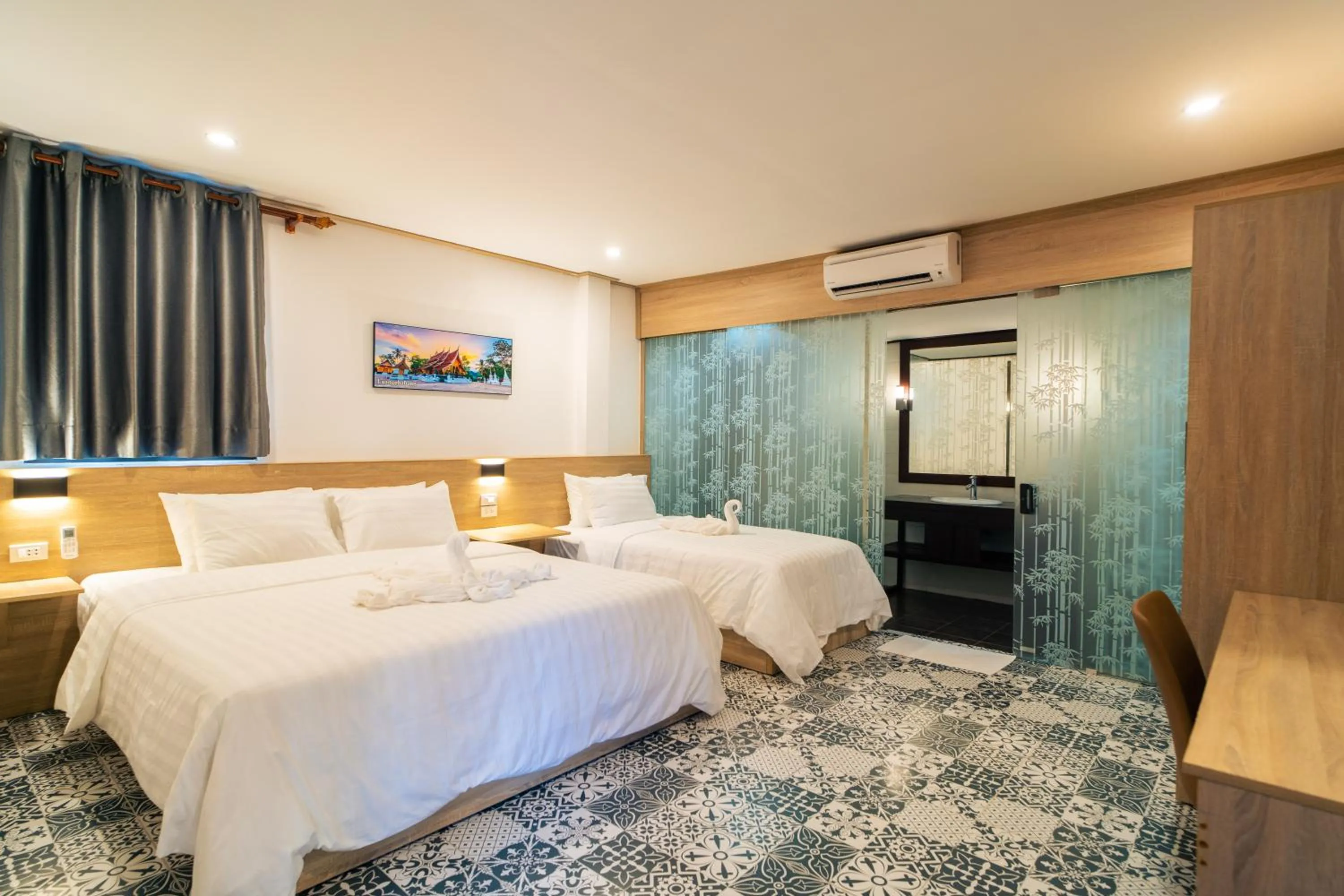 Bed in New Champa Boutique Hotel