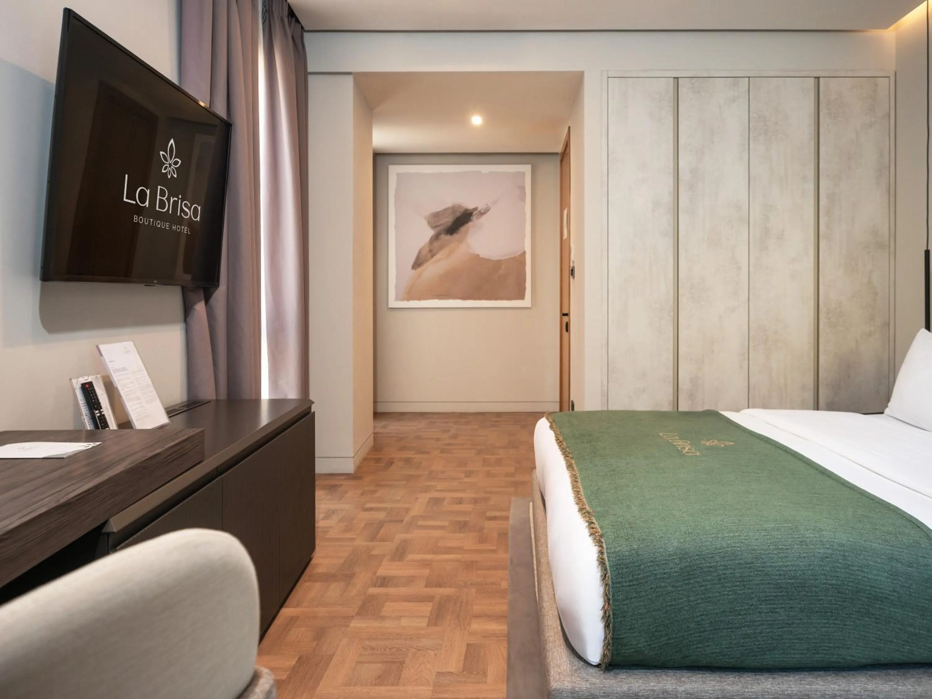 Bed in La Brisa Boutique Hotel