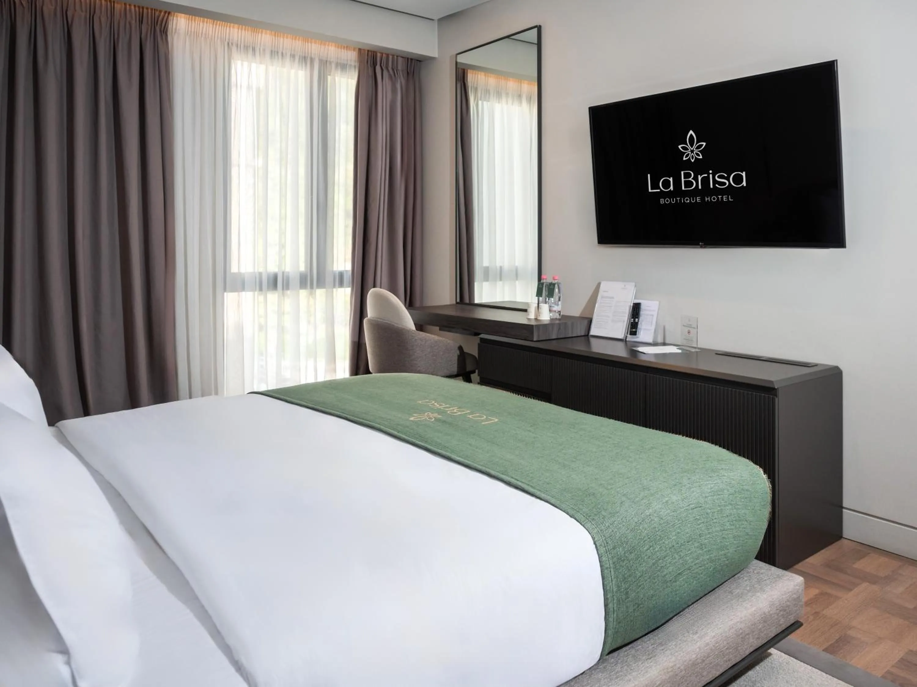 Bed in La Brisa Boutique Hotel