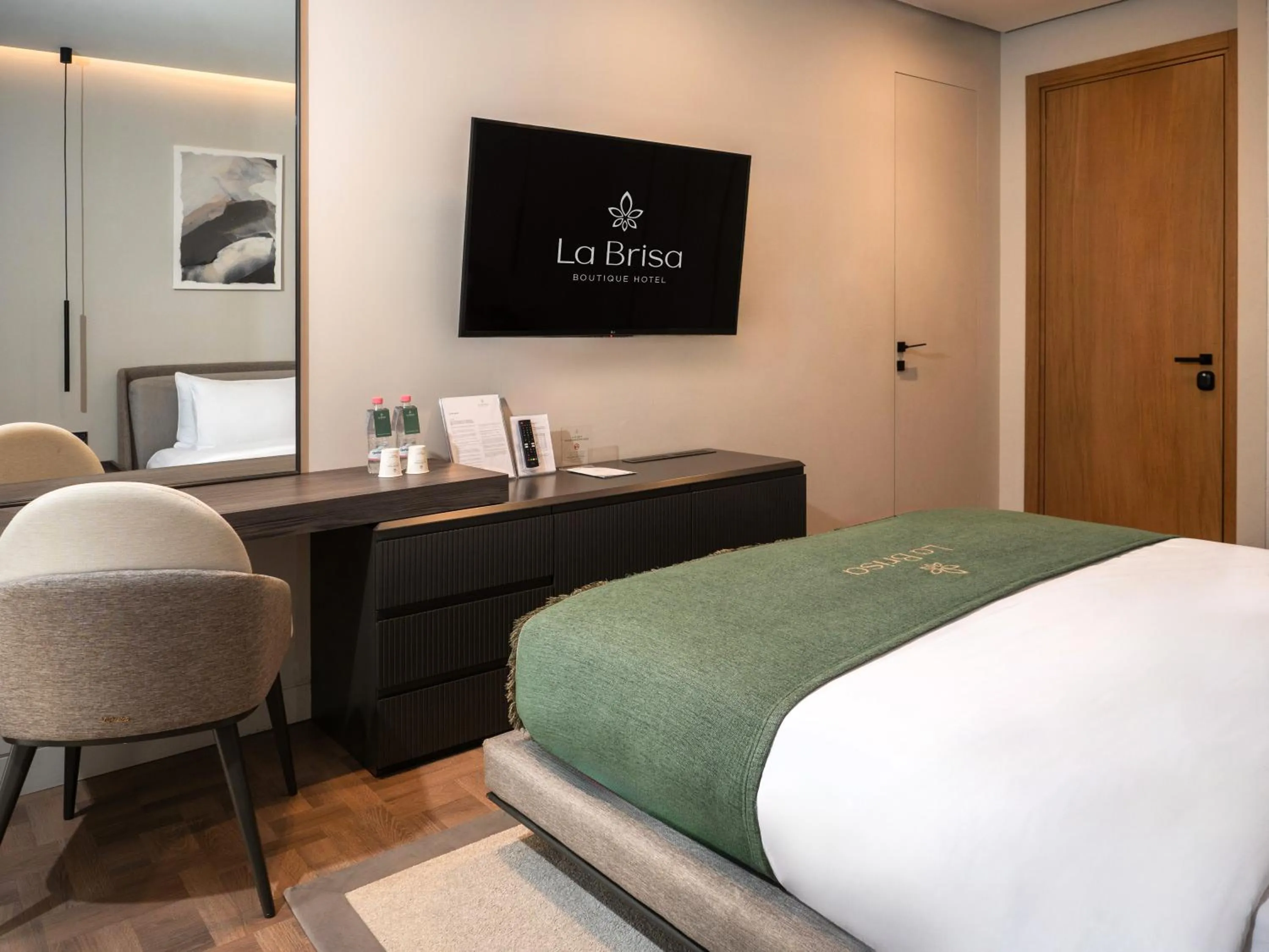 Bed in La Brisa Boutique Hotel