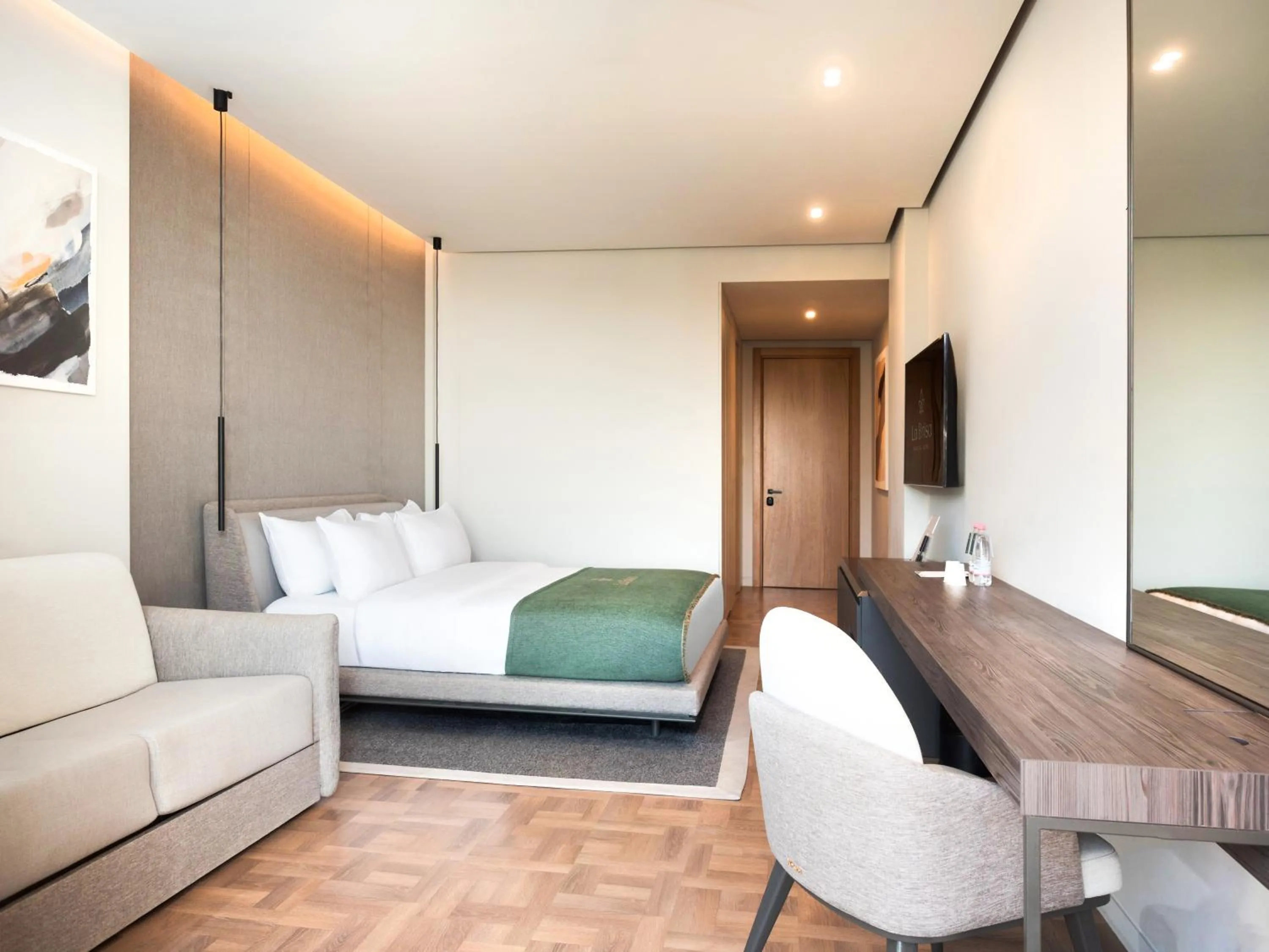 Bed in La Brisa Boutique Hotel