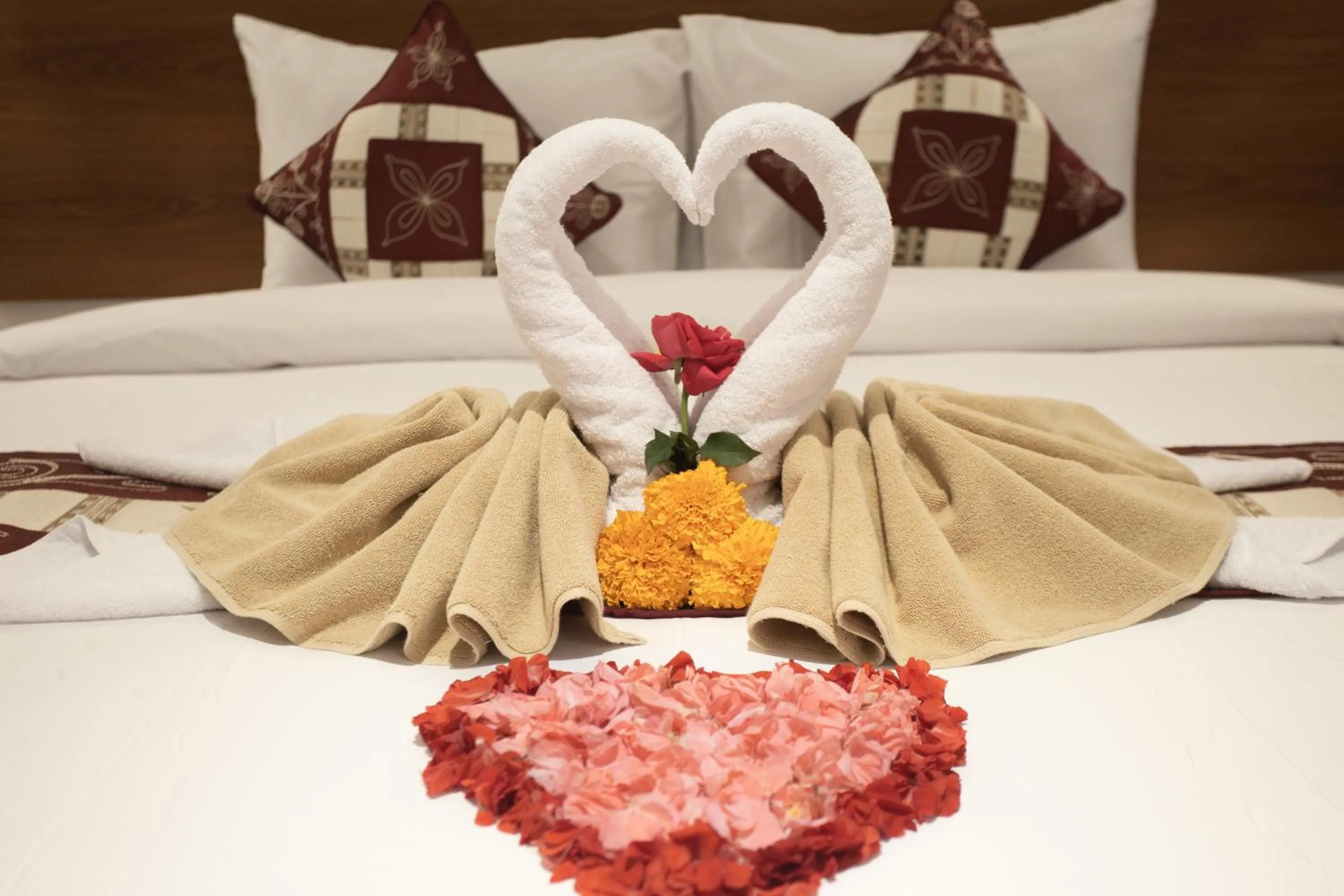 Bed in The Kd Suites & Coffee Shop