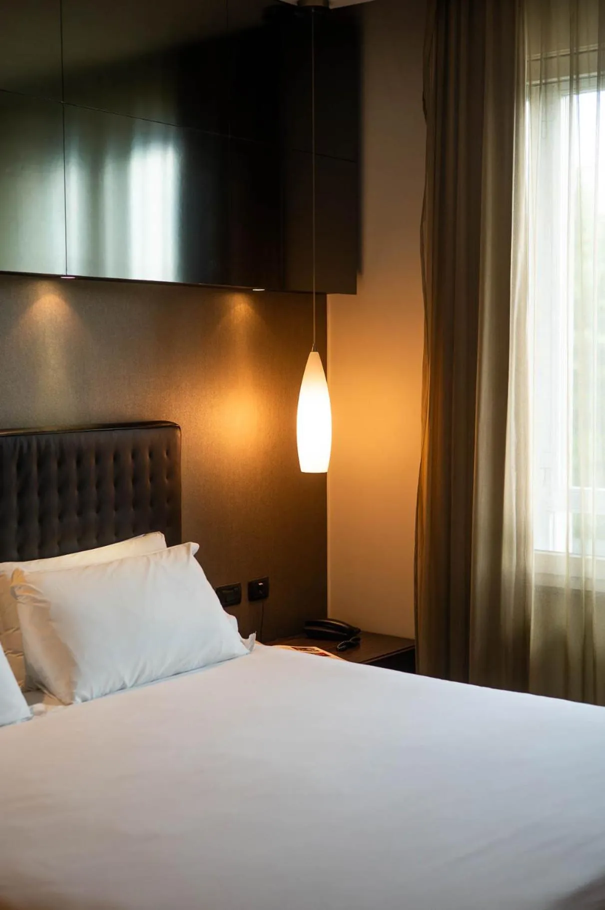 Bed in Axolute Comfort Hotel Como Cantù