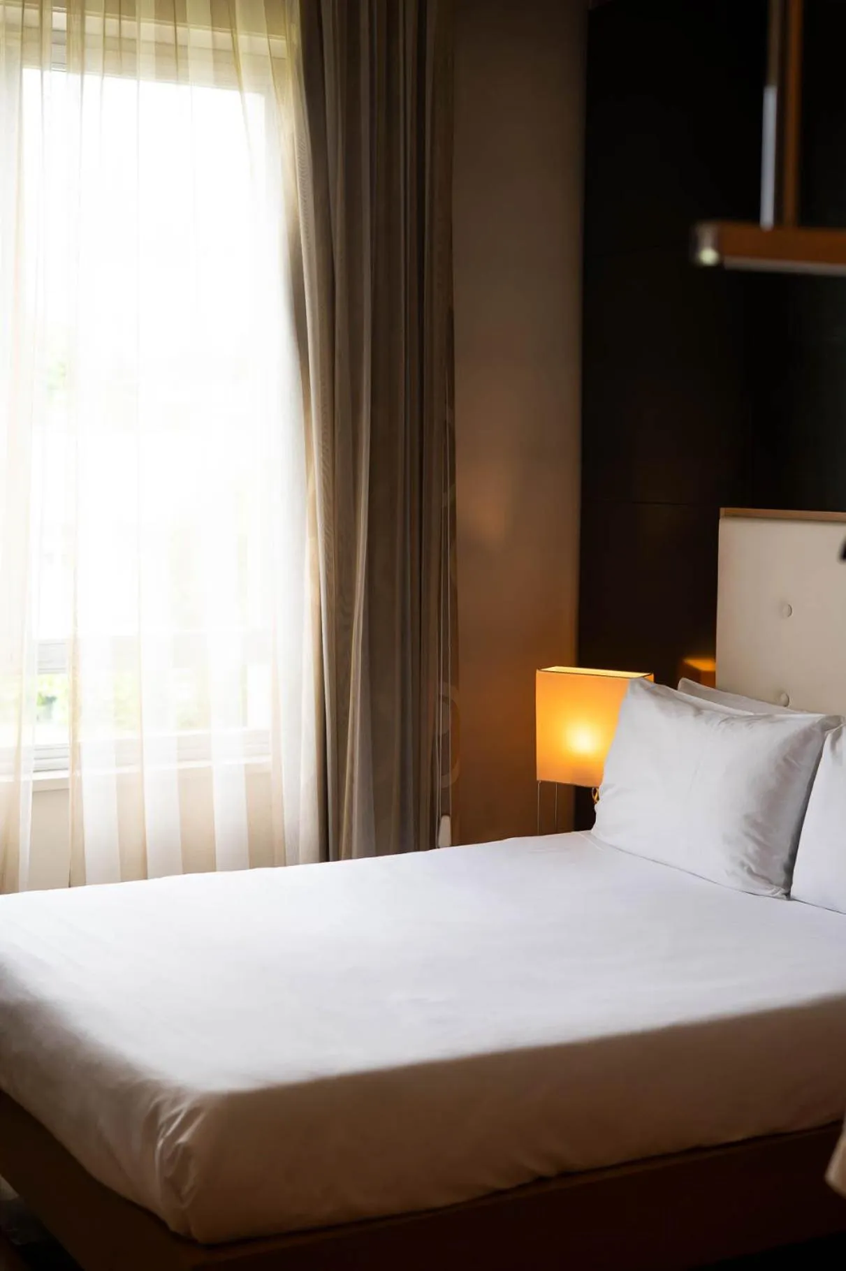 Bed in Axolute Comfort Hotel Como Cantù