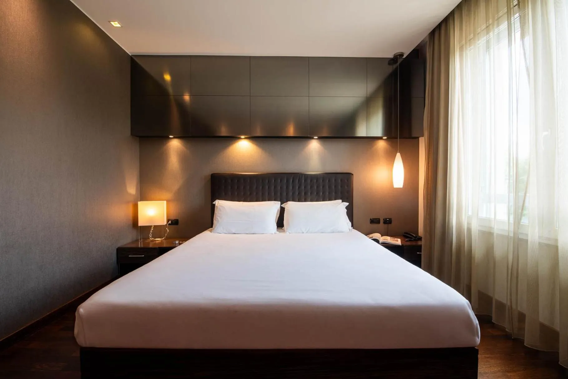 Bed in Axolute Comfort Hotel Como Cantù