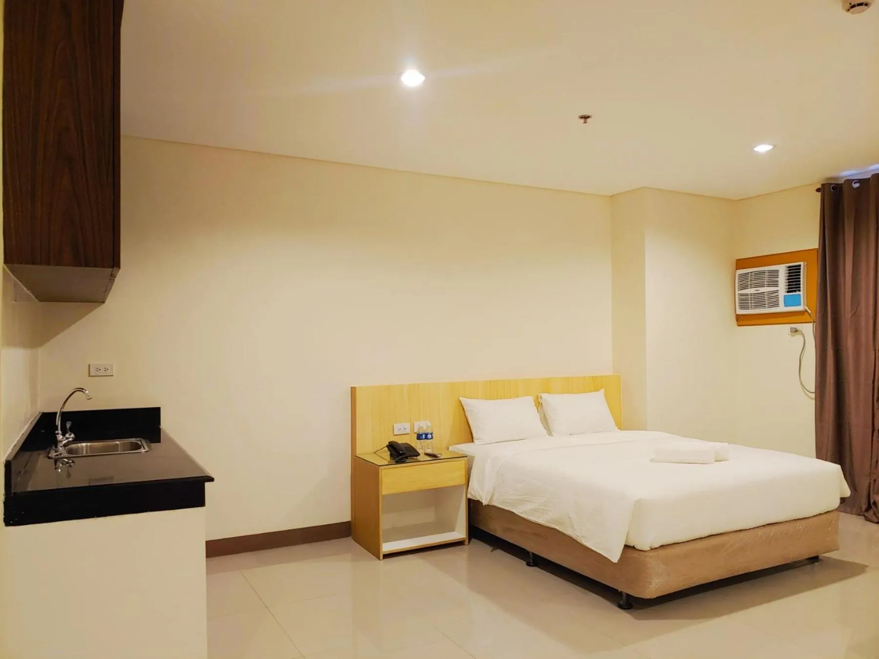 Photo of the whole room, Bed in Kaizen Suites