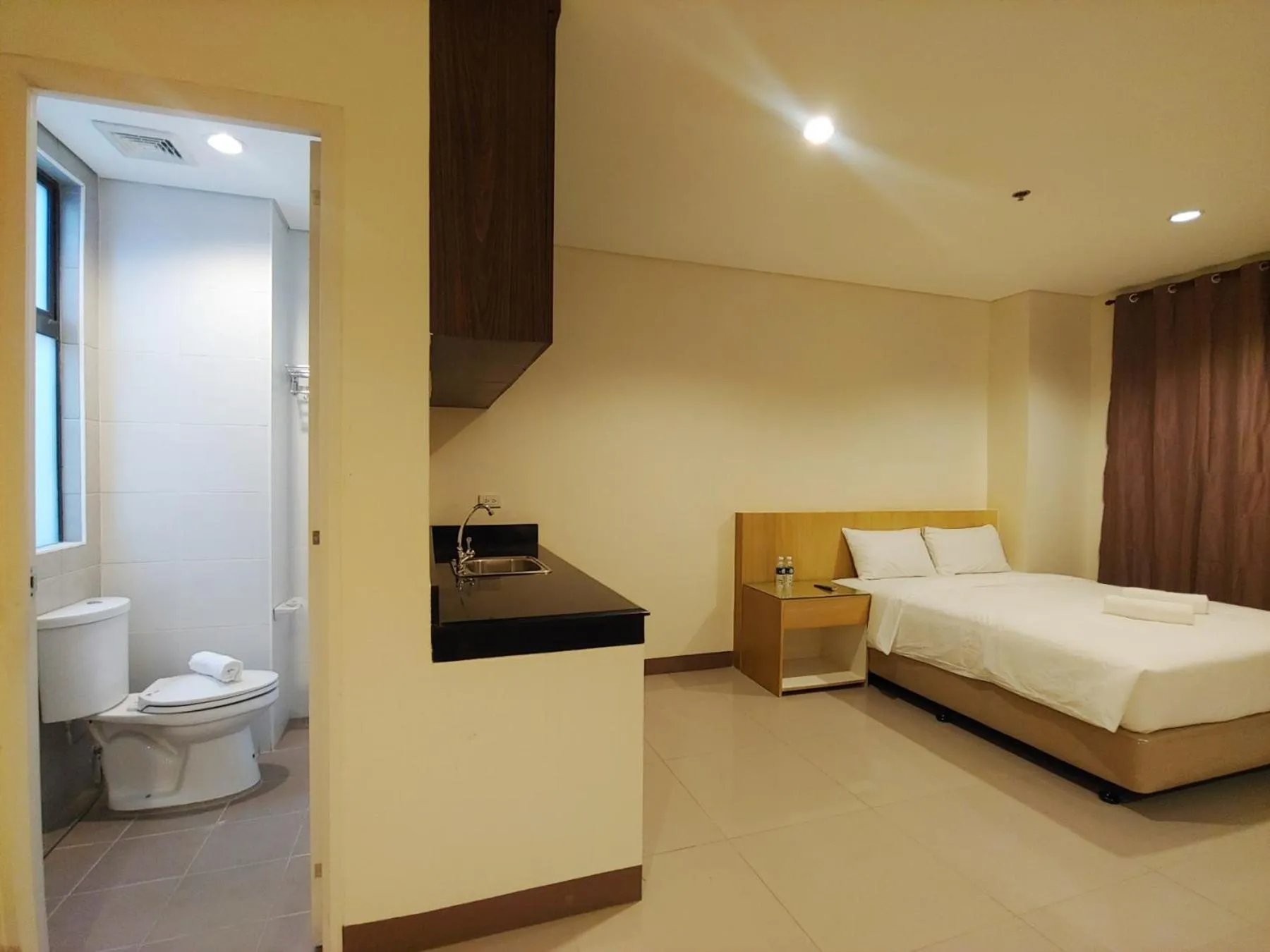 Photo of the whole room, Bed in Kaizen Suites