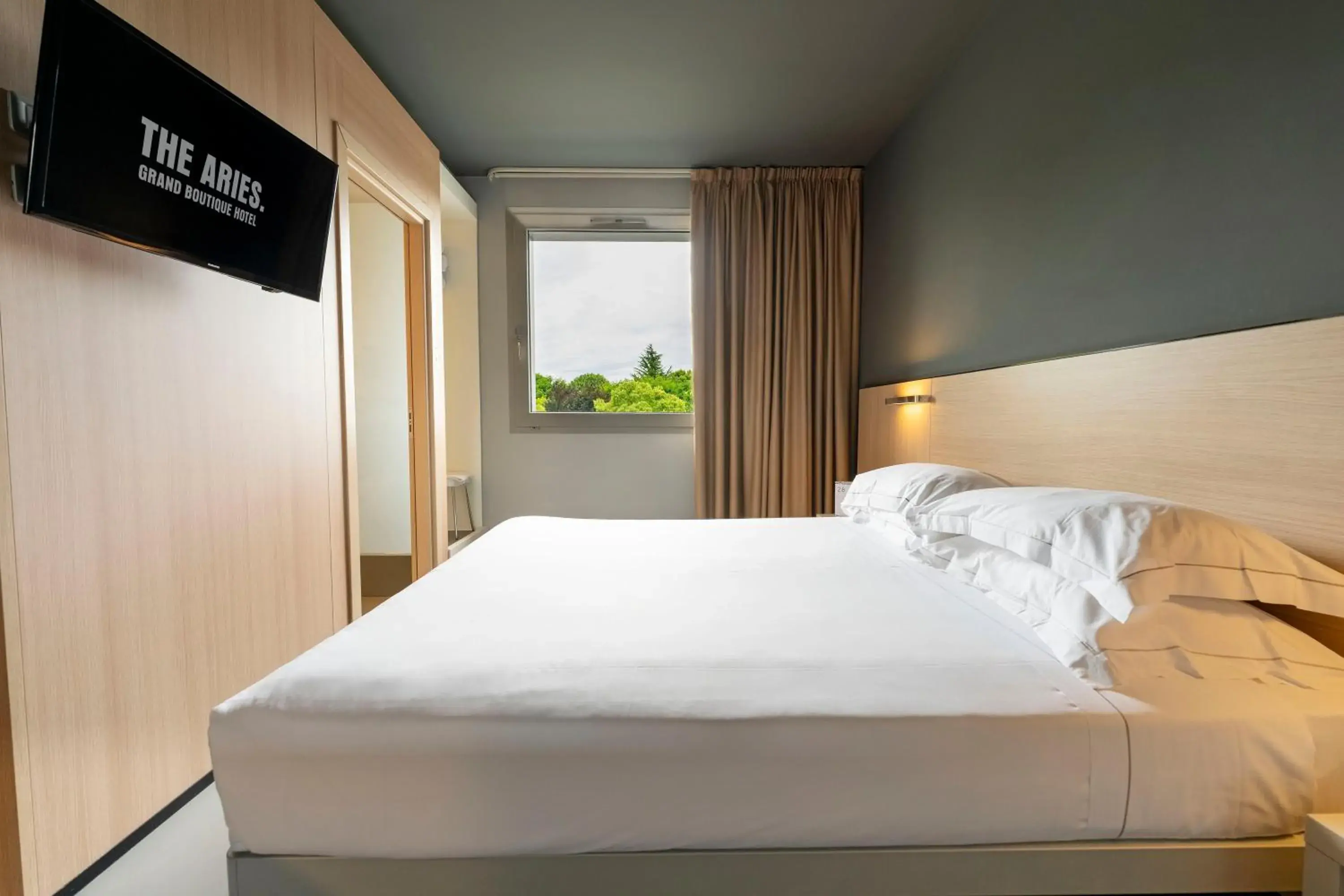 Bed in The Aries Hotel Bed in The Aries Hotel