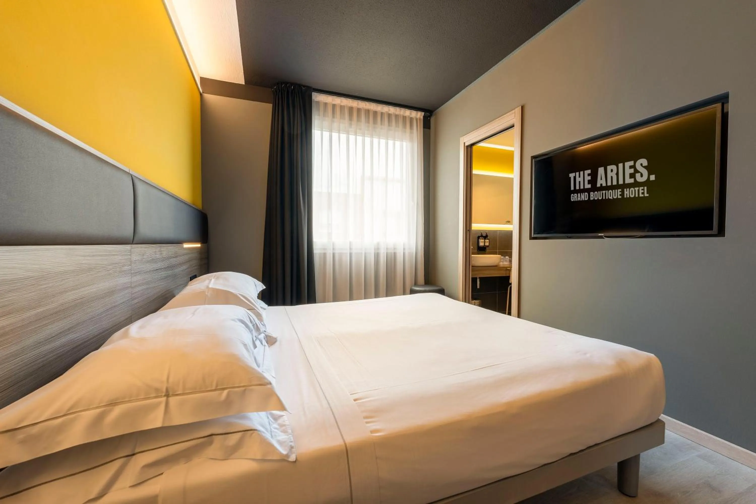 Bed in The Aries Hotel