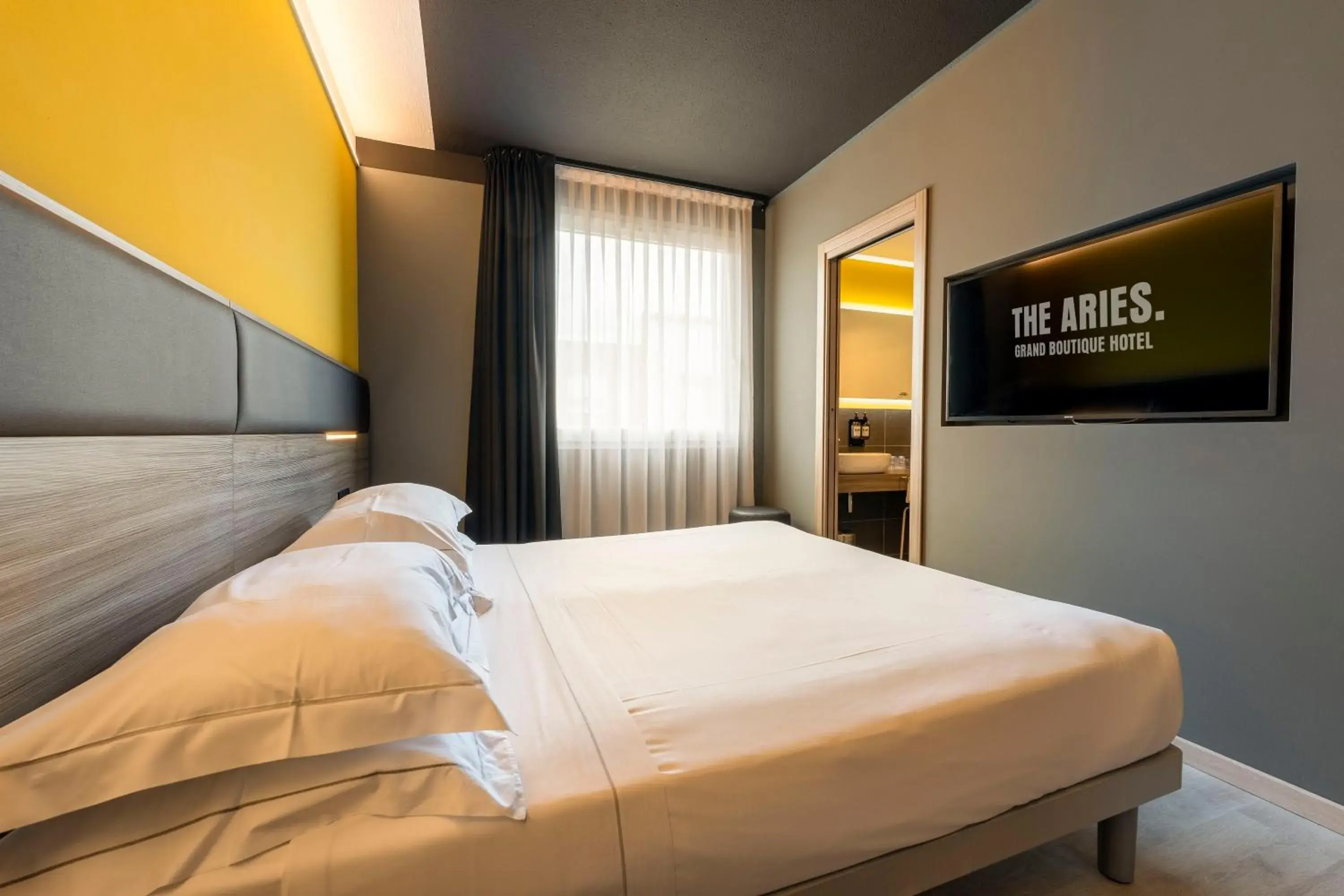 Bed in The Aries Hotel Bed in The Aries Hotel