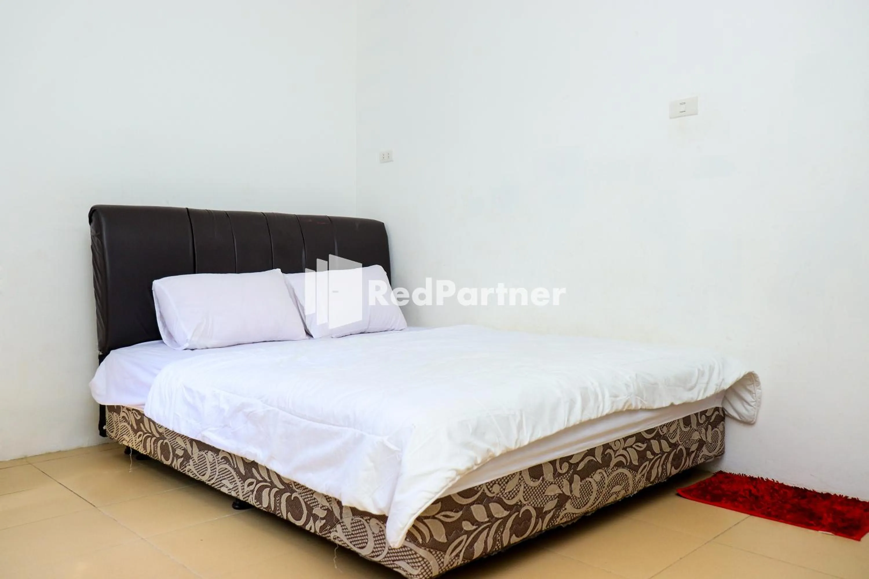 Bedroom in Sahabat Pantai Guest House Mitra RedDoorz