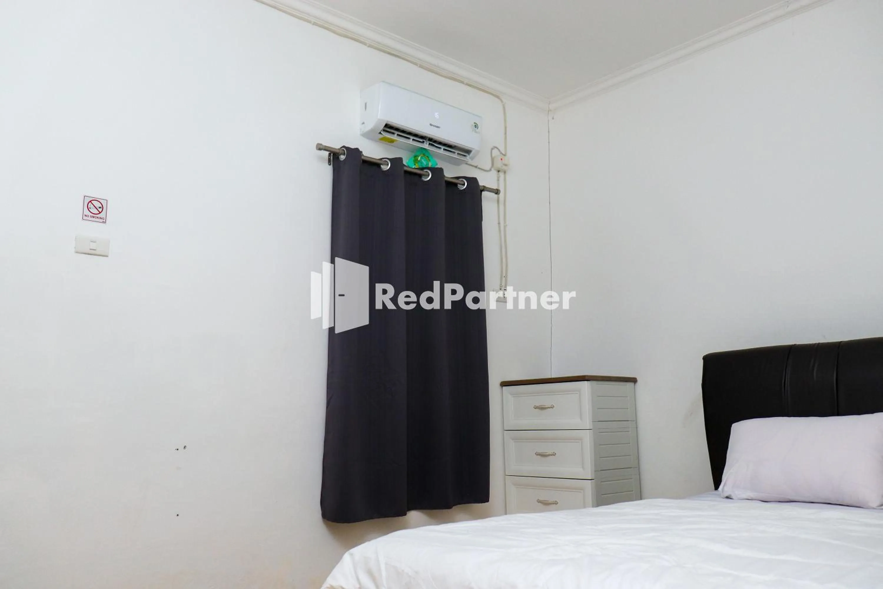 Bedroom in Sahabat Pantai Guest House Mitra RedDoorz