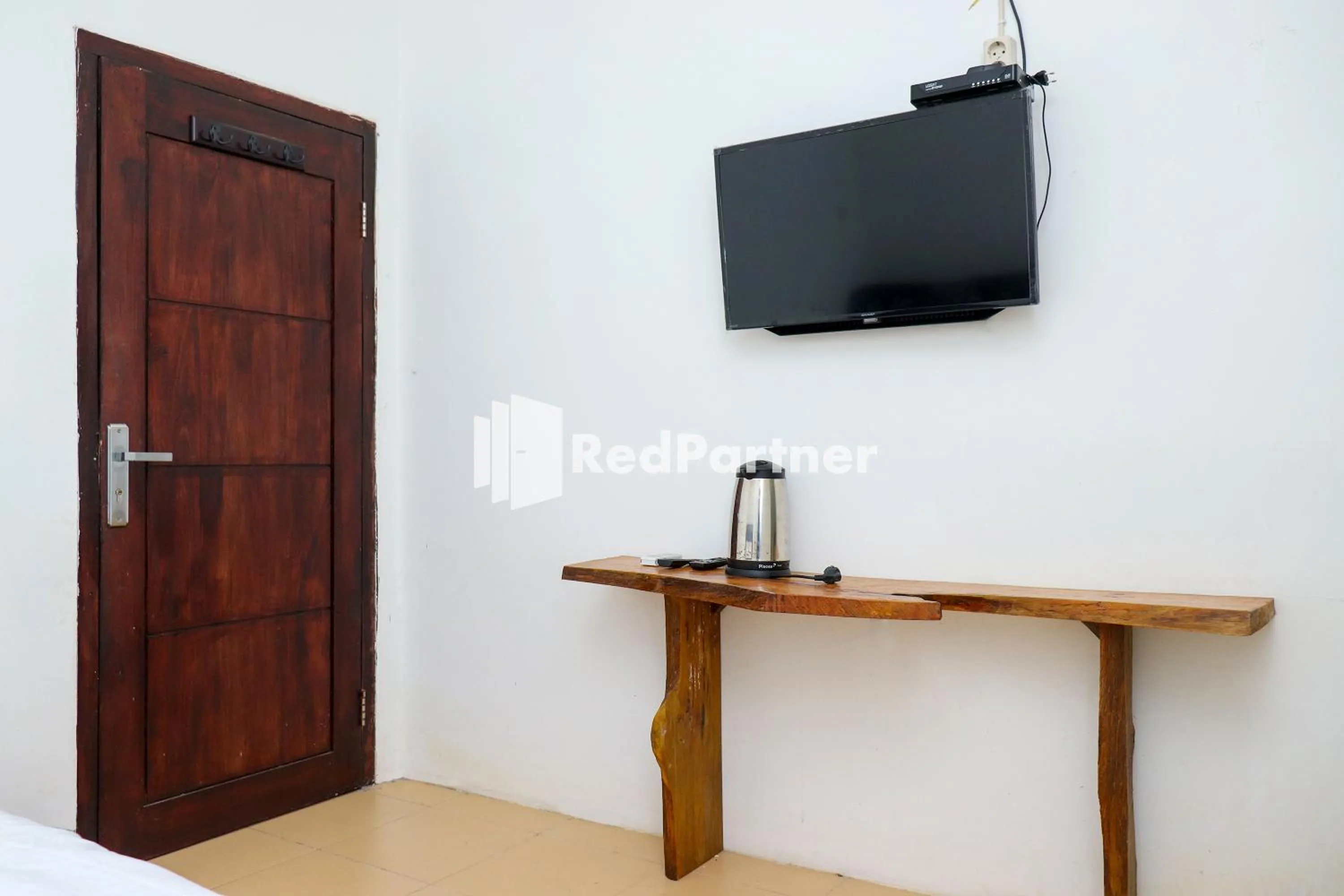 Bedroom in Sahabat Pantai Guest House Mitra RedDoorz