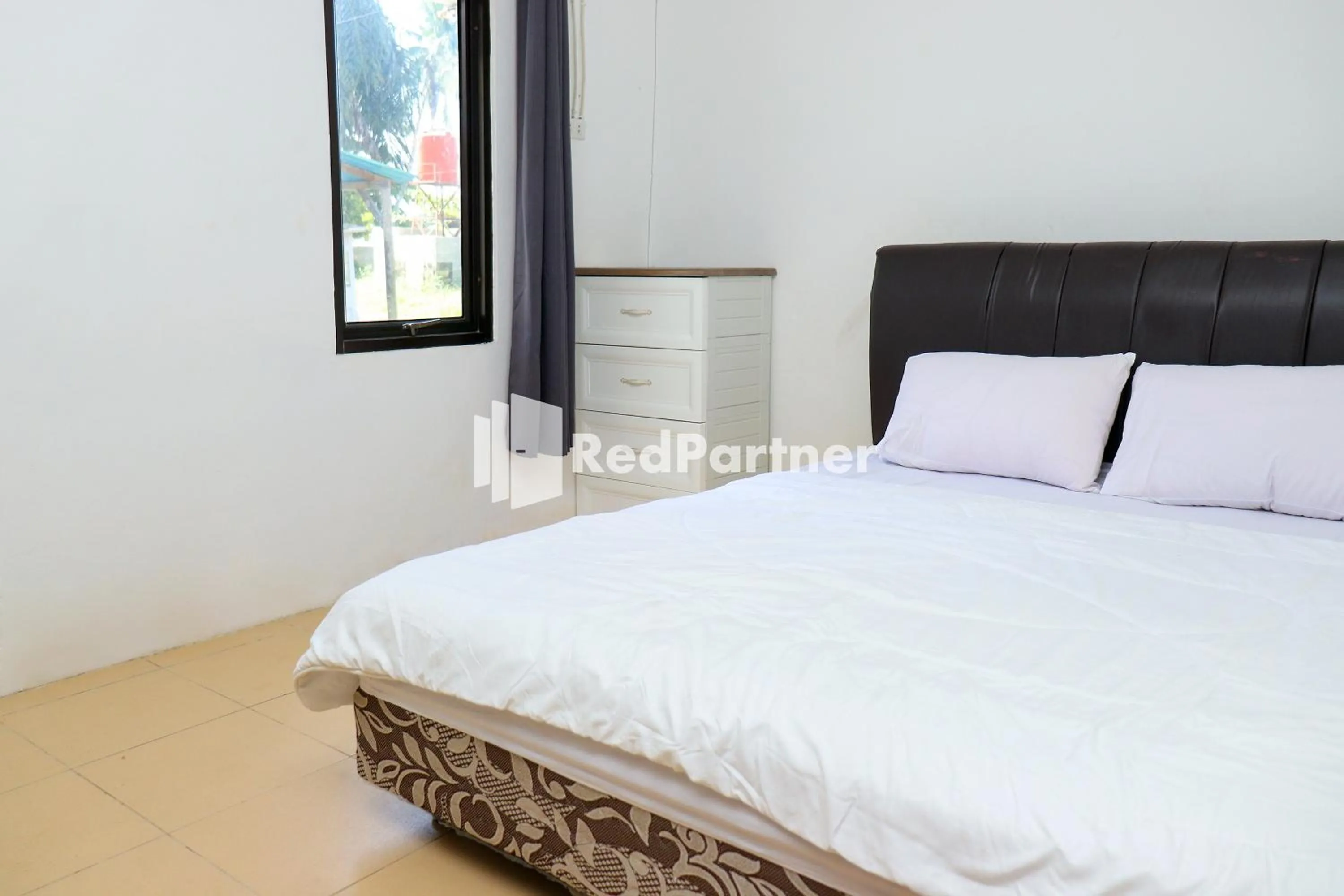 Bedroom in Sahabat Pantai Guest House Mitra RedDoorz