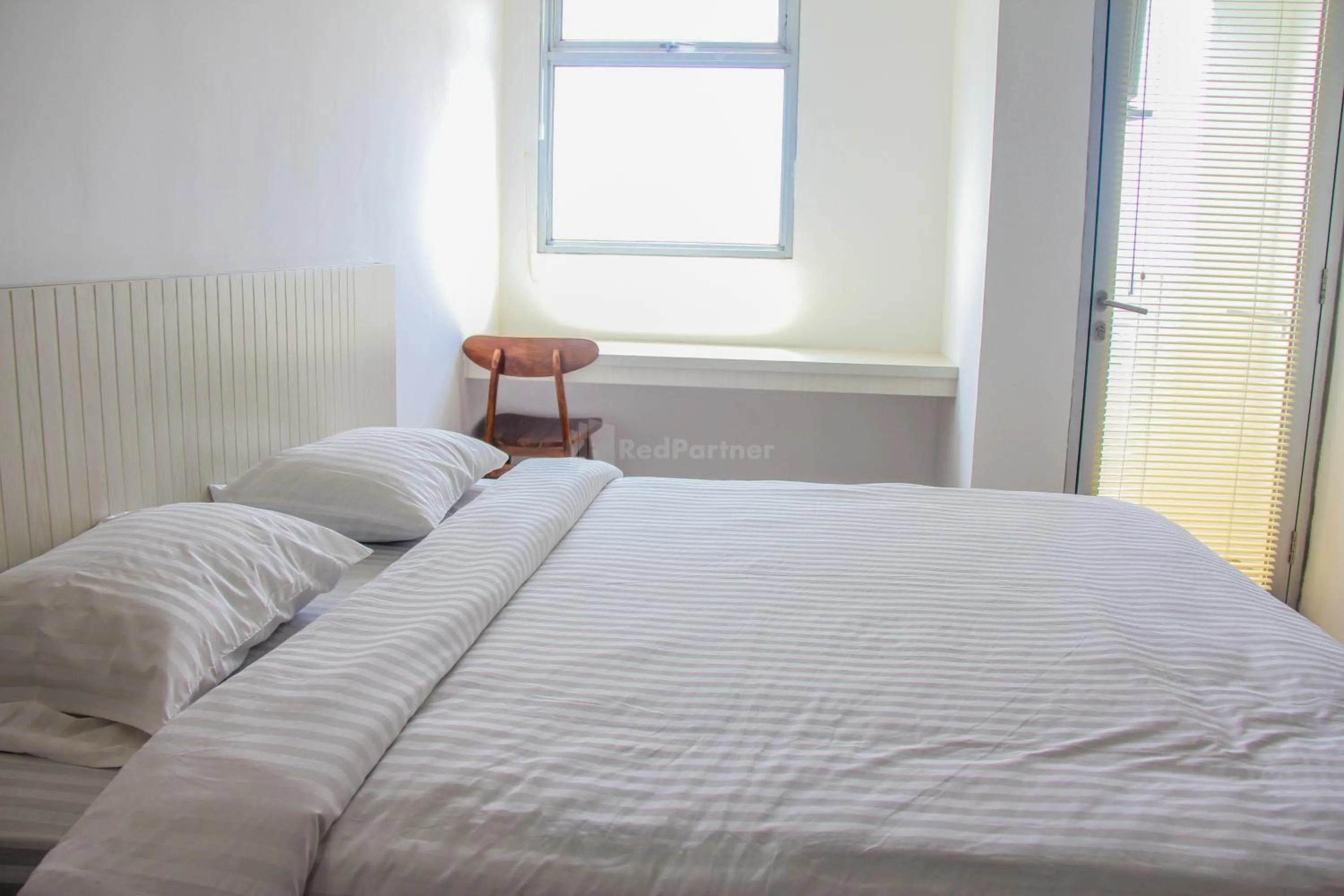 Bedroom in RedLiving Apartemen Gunung Putri Square - Abidin Room Tower Pinus