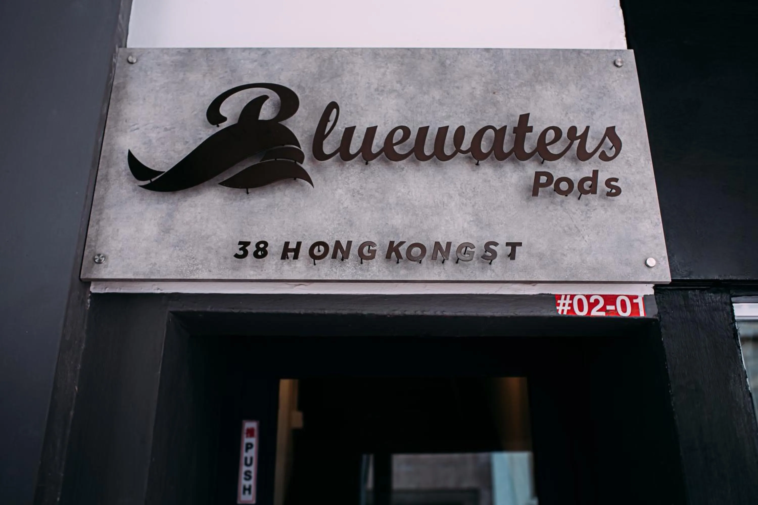 Property logo or sign in Bluewaters Pods 38 Hongkong St