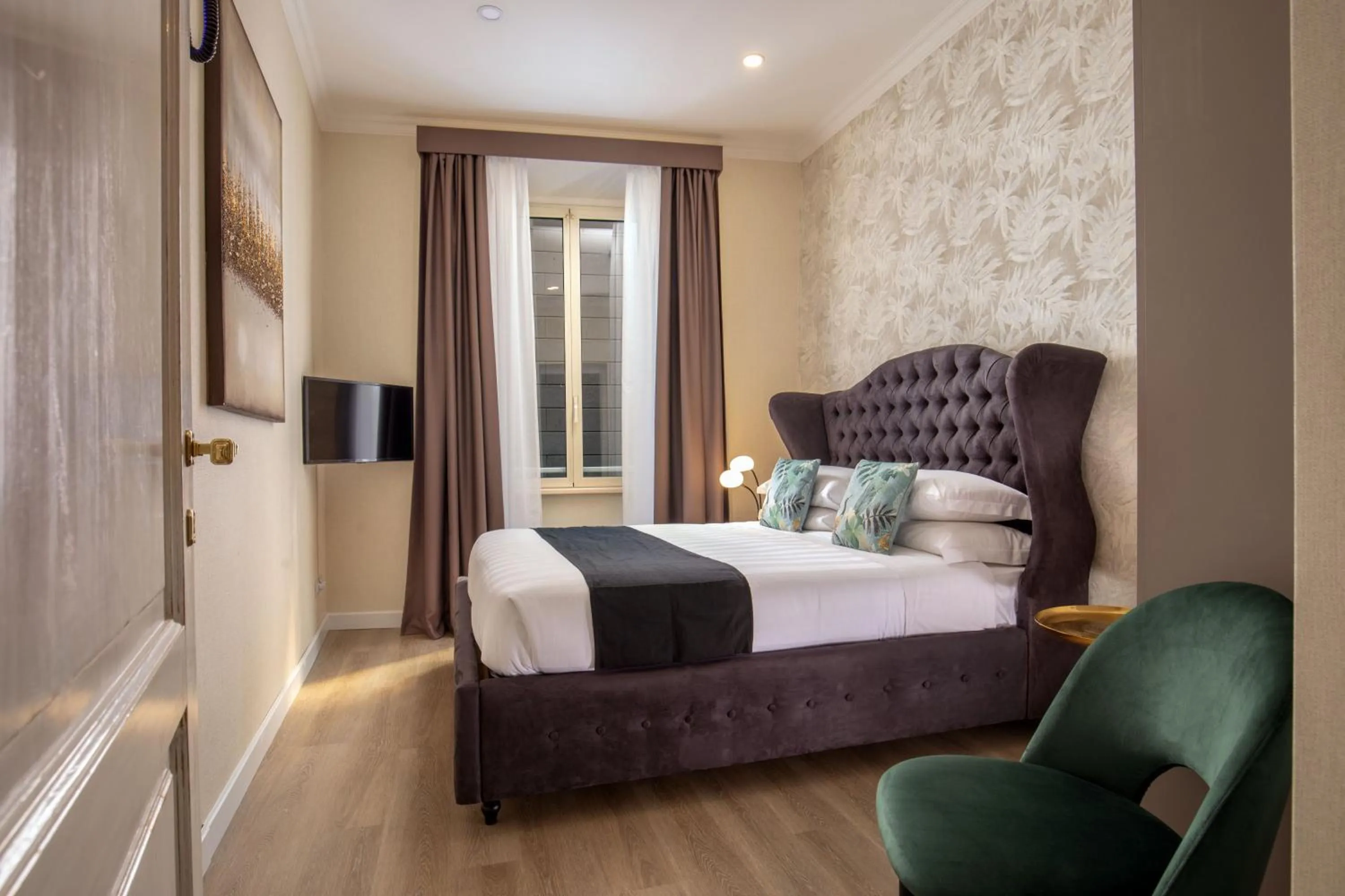 Bed in Condotti Boutique Hotel