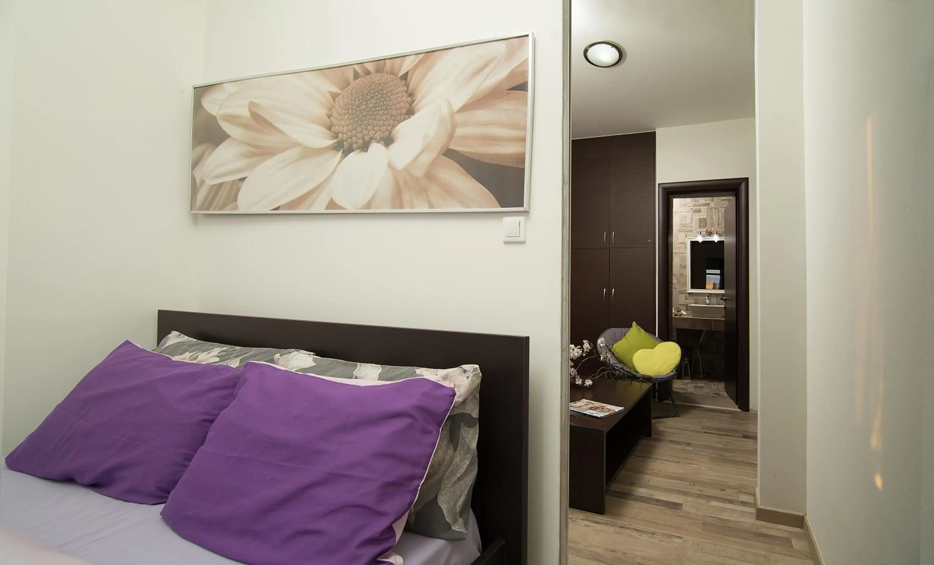 Living room, Bed in Home Suites