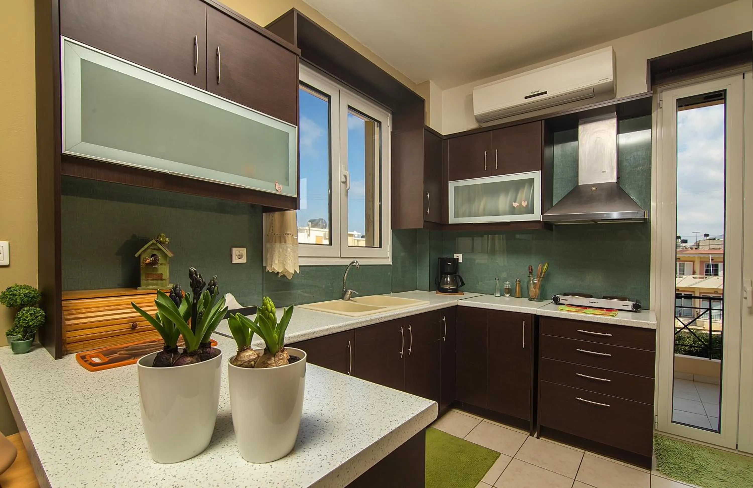 Kitchen or kitchenette in Home Suites