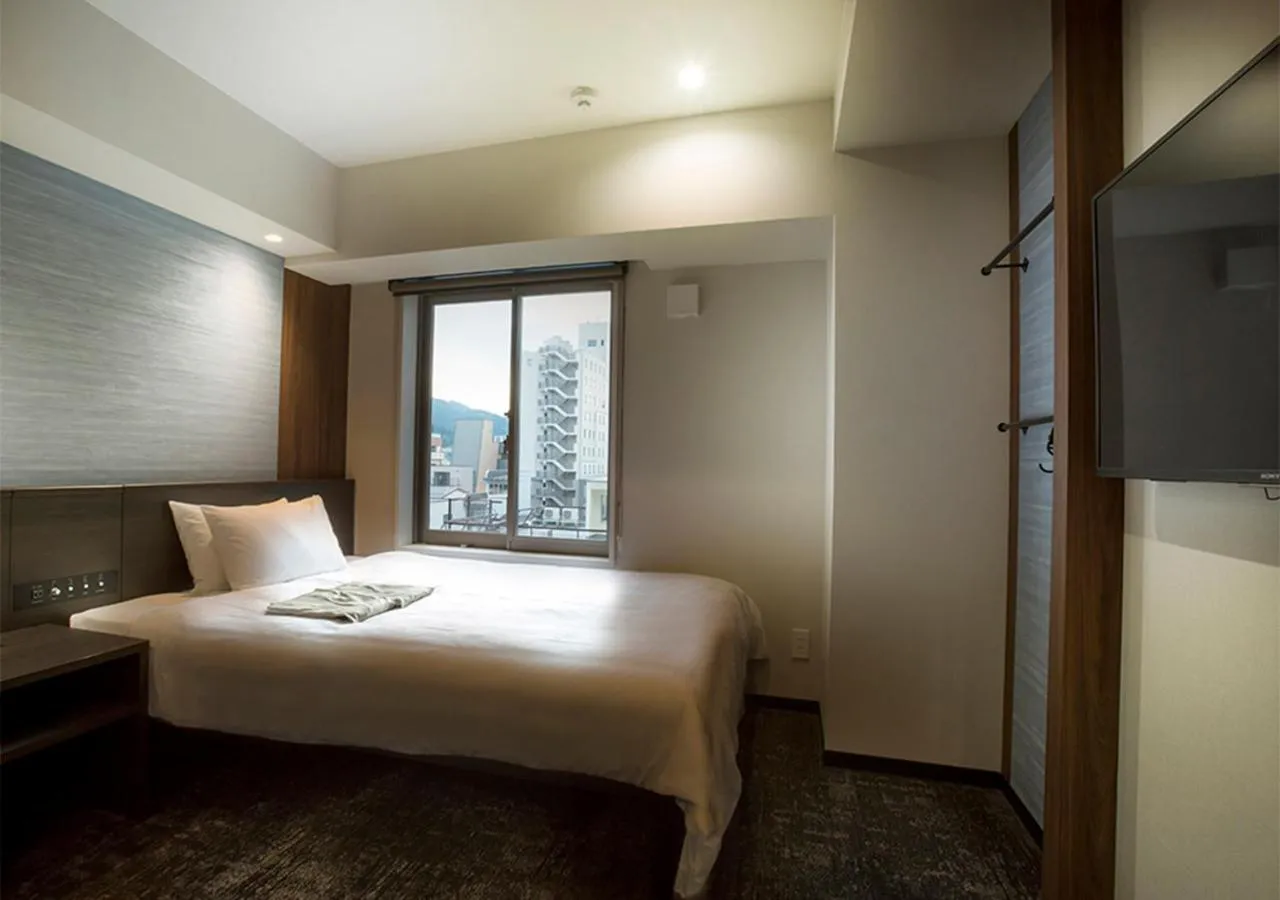 Photo of the whole room, Bed in Hotel and Spa Gift TAKAYAMA