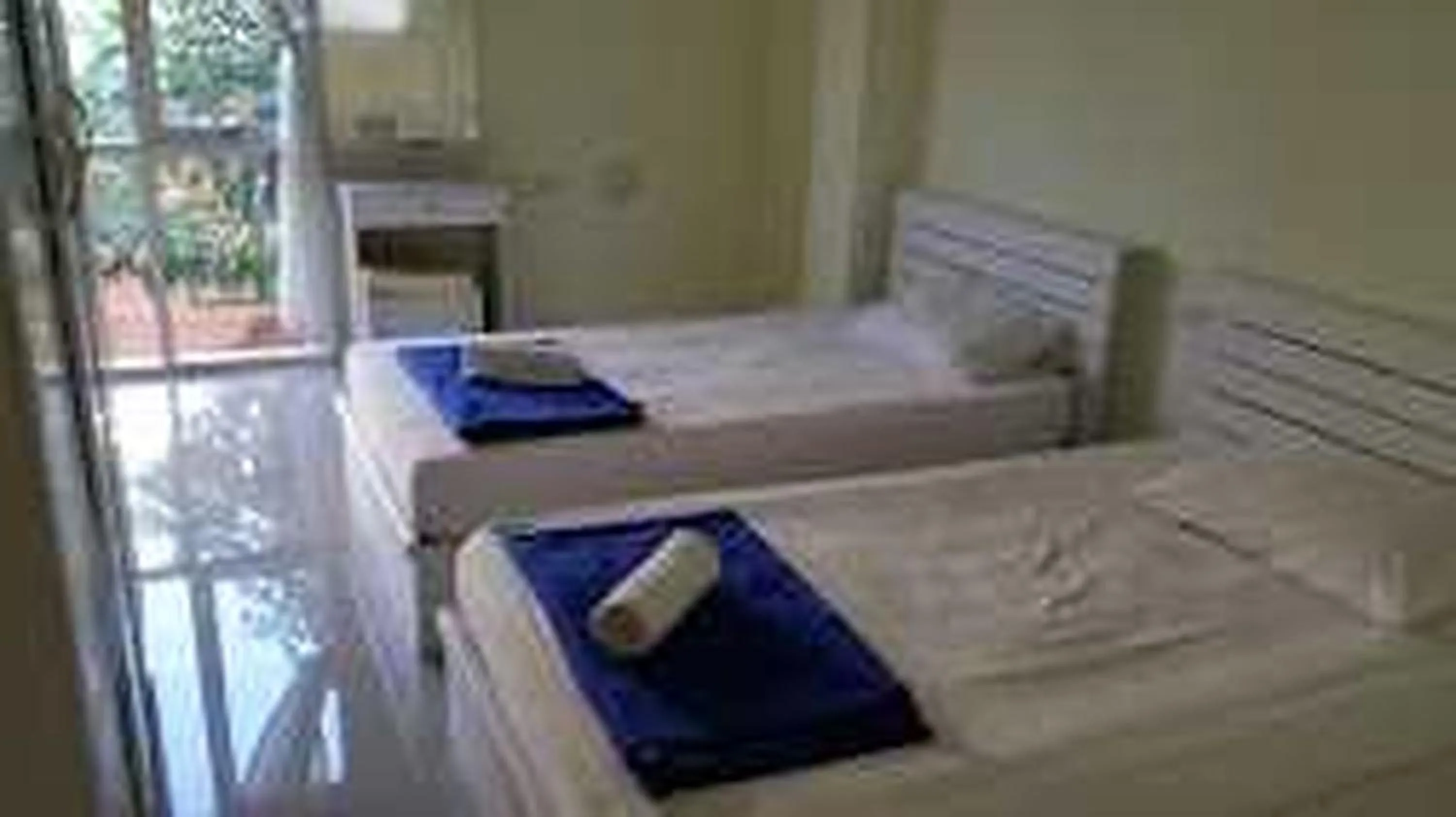 Bed in RQ Bangkok Sukhumvit 50 by Collection O