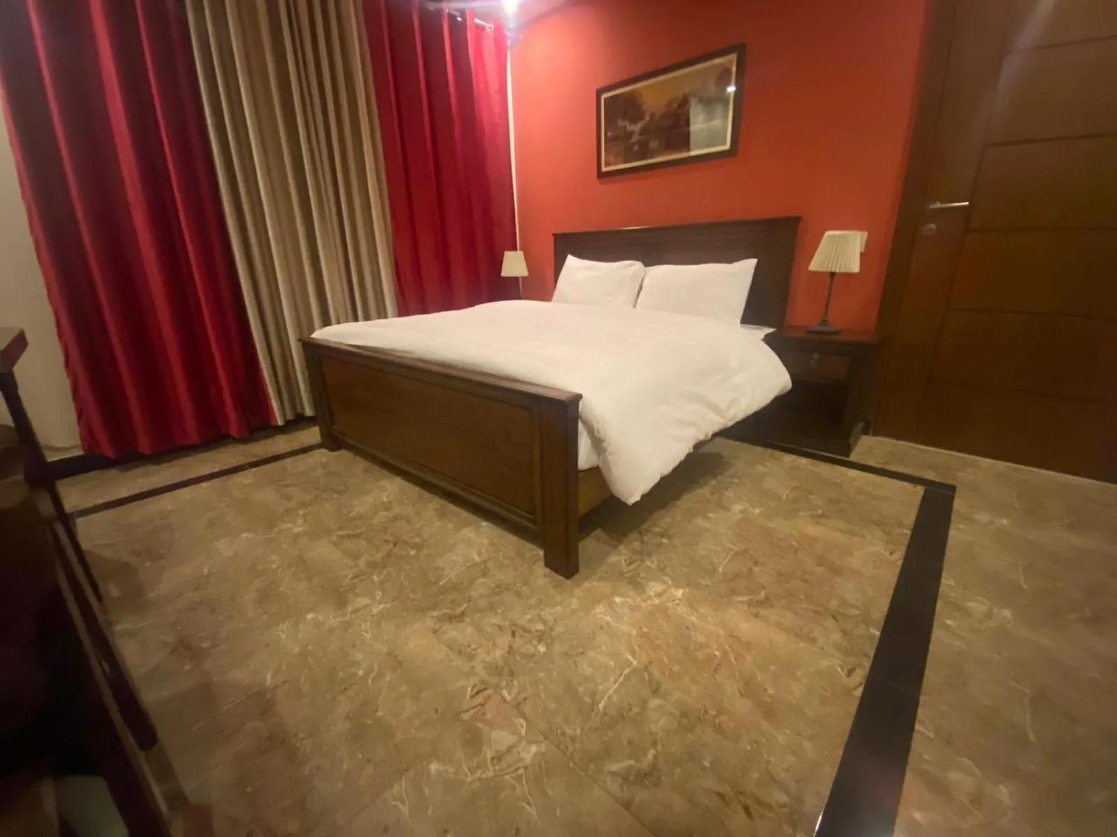 Bed in AK Hotel & Suites