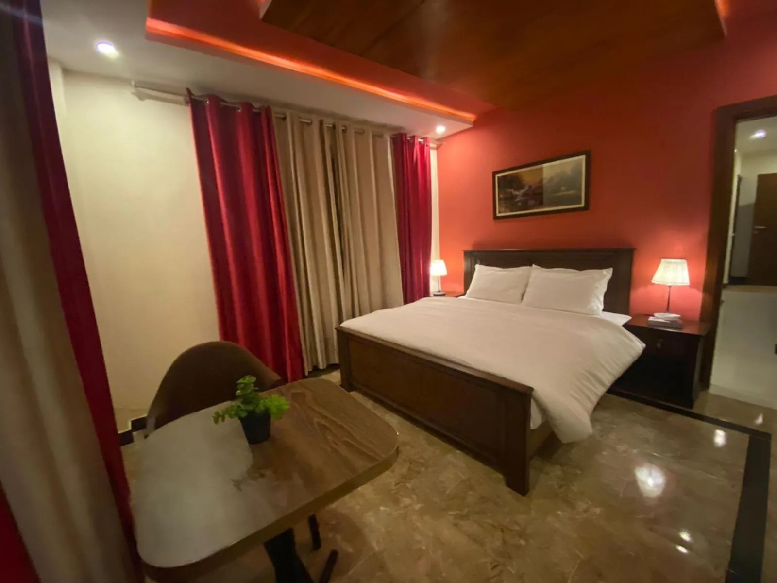 Bed in AK Hotel & Suites