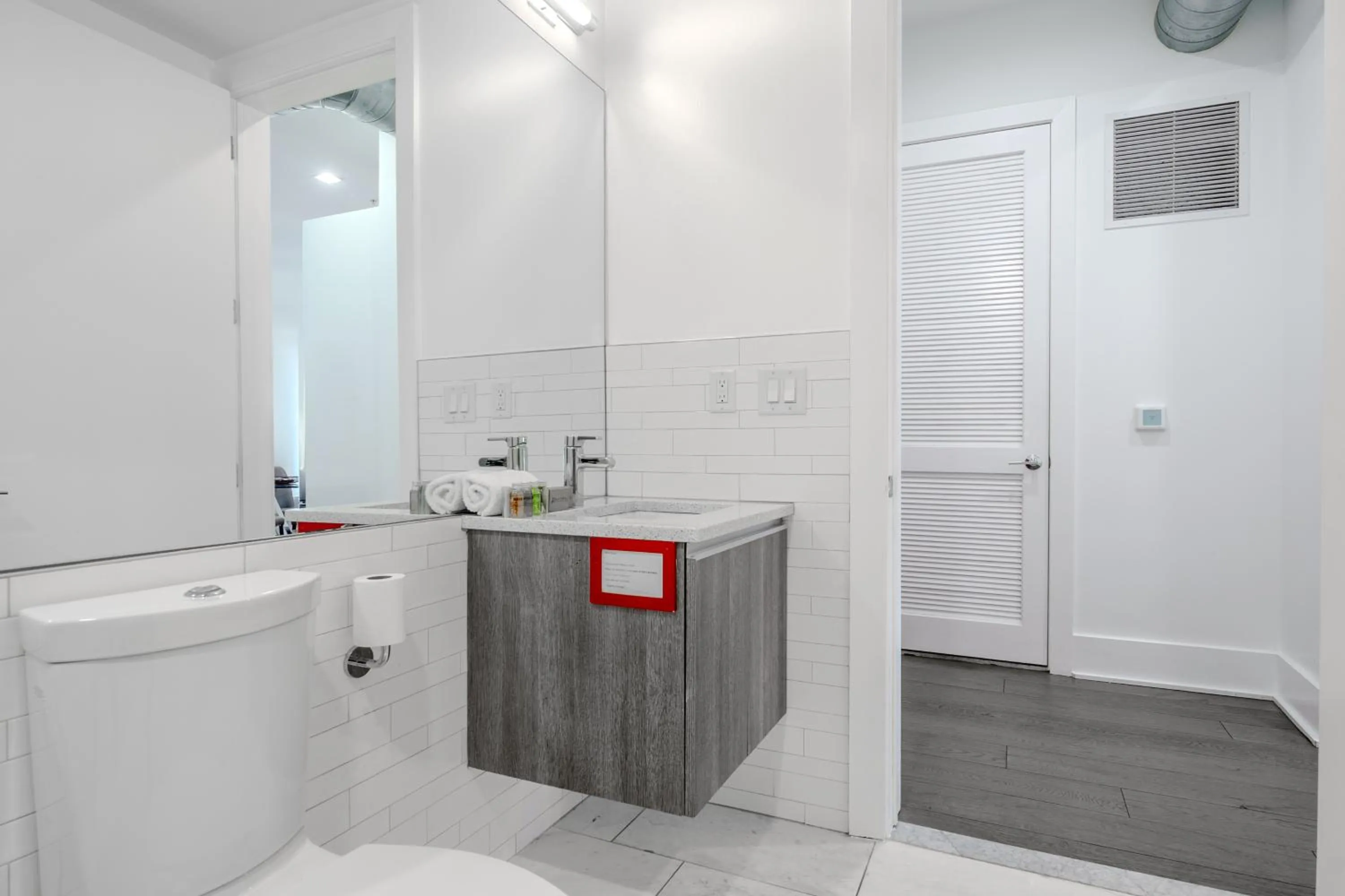 Toilet in Dharma Home Suites Hoboken