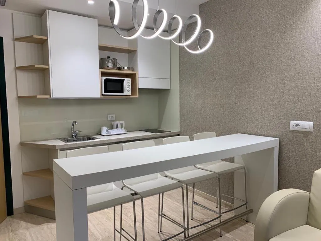 Kitchen or kitchenette in Astoria Suite Hotel