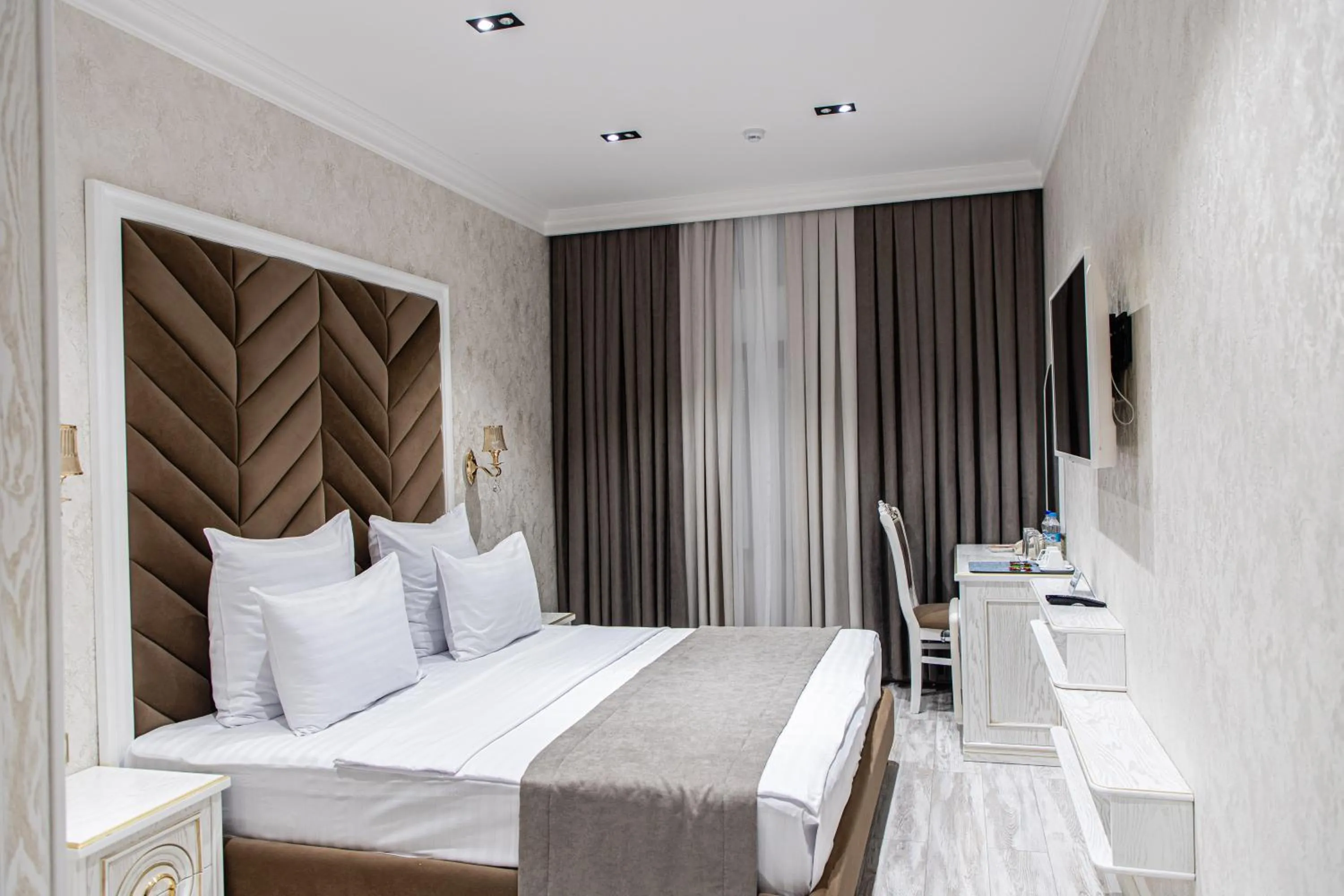 Bed in Golden Samarkand Hotel