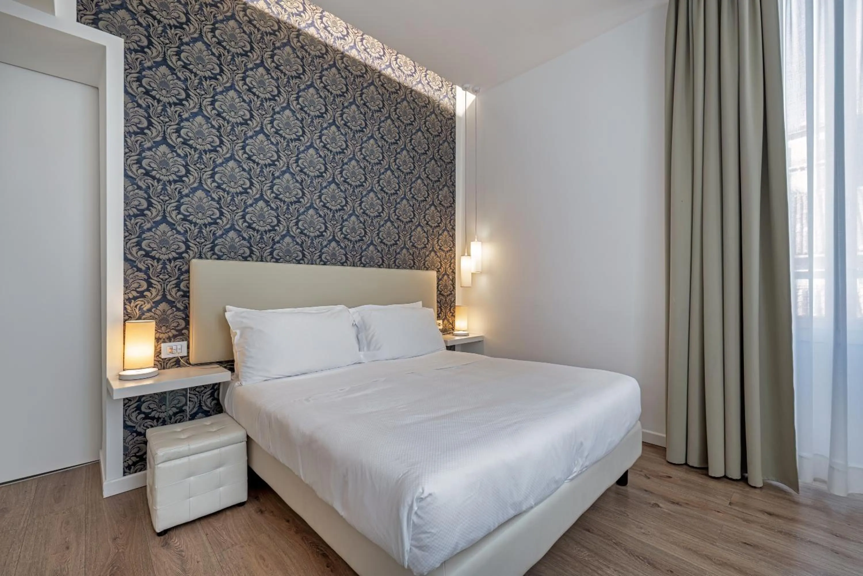 Bed in Sanremo Luxury Suites